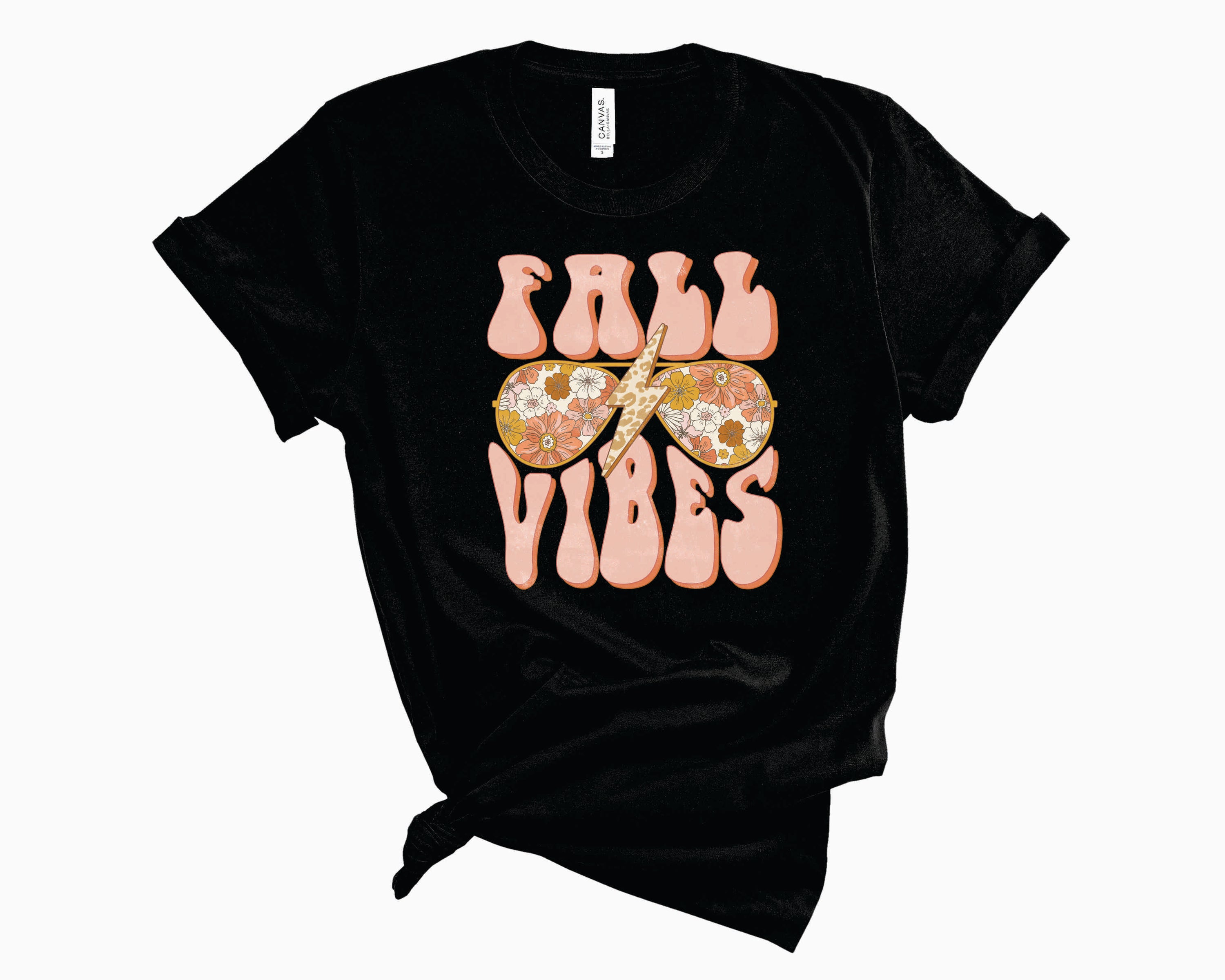 A unisex graphic tee featuring vintage glasses and autumn leaves, perfect for fall fashion.