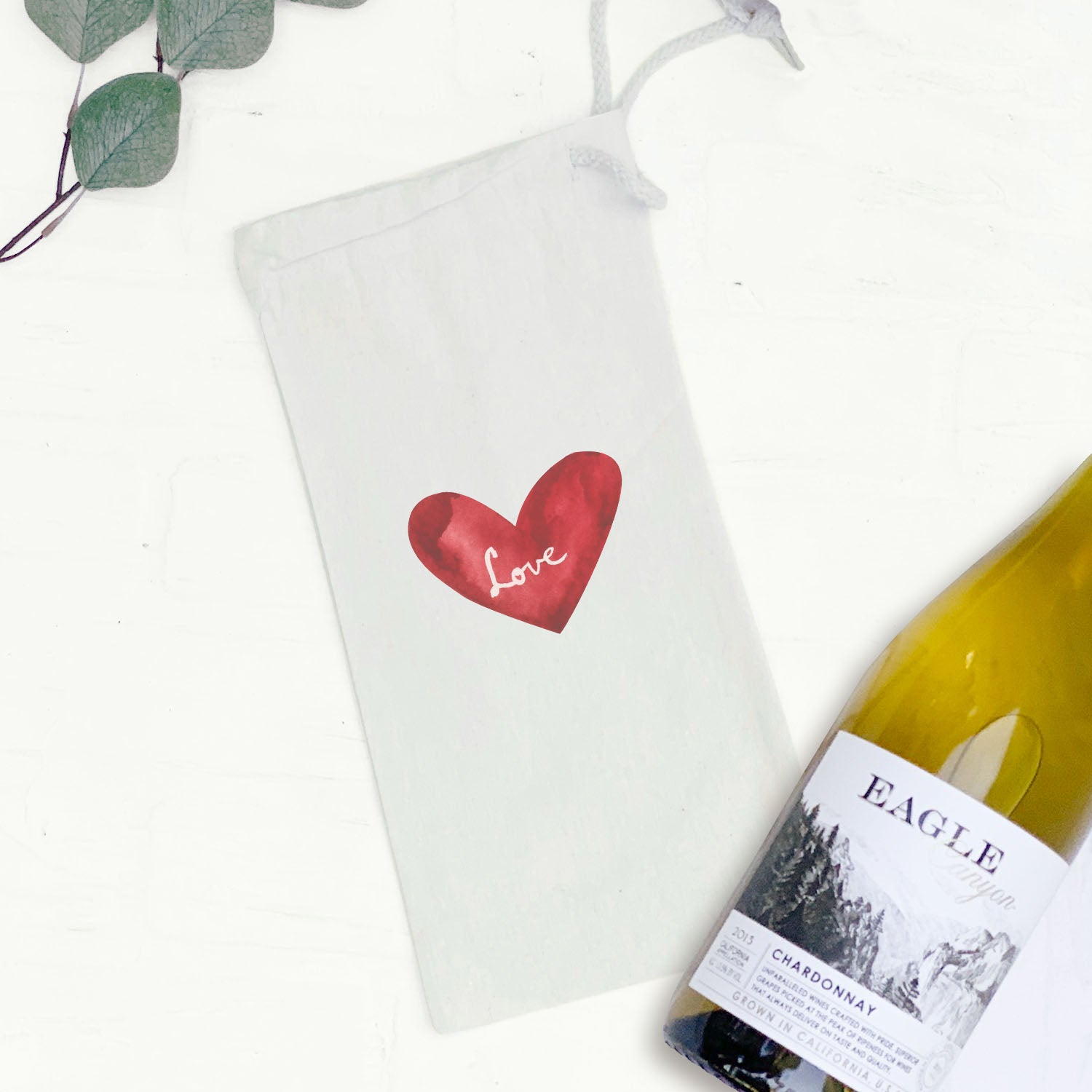 A stylish Watercolor Love Heart Red canvas wine bag featuring a beautiful heart design, perfect for gifting wine bottles.