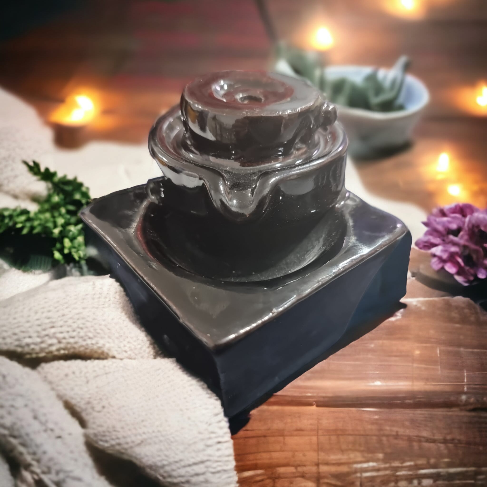 Well-Style Backflow Incense Burner with cascading smoke effect, showcasing its elegant design and tranquil ambiance.