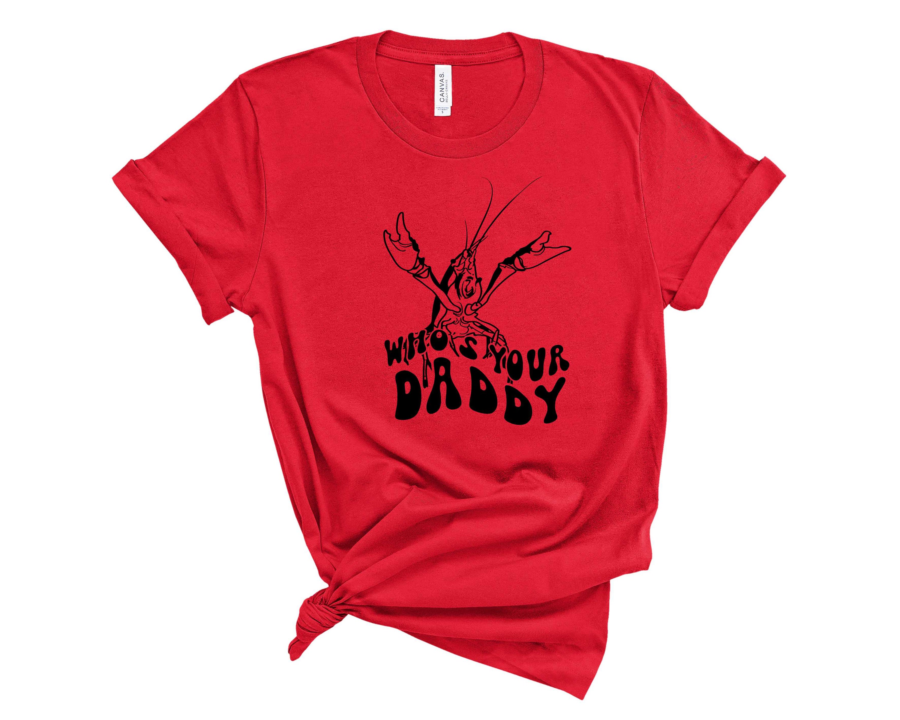 A stylish unisex graphic tee featuring the phrase 'Who's Your Daddy' in bold lettering, perfect for casual wear.