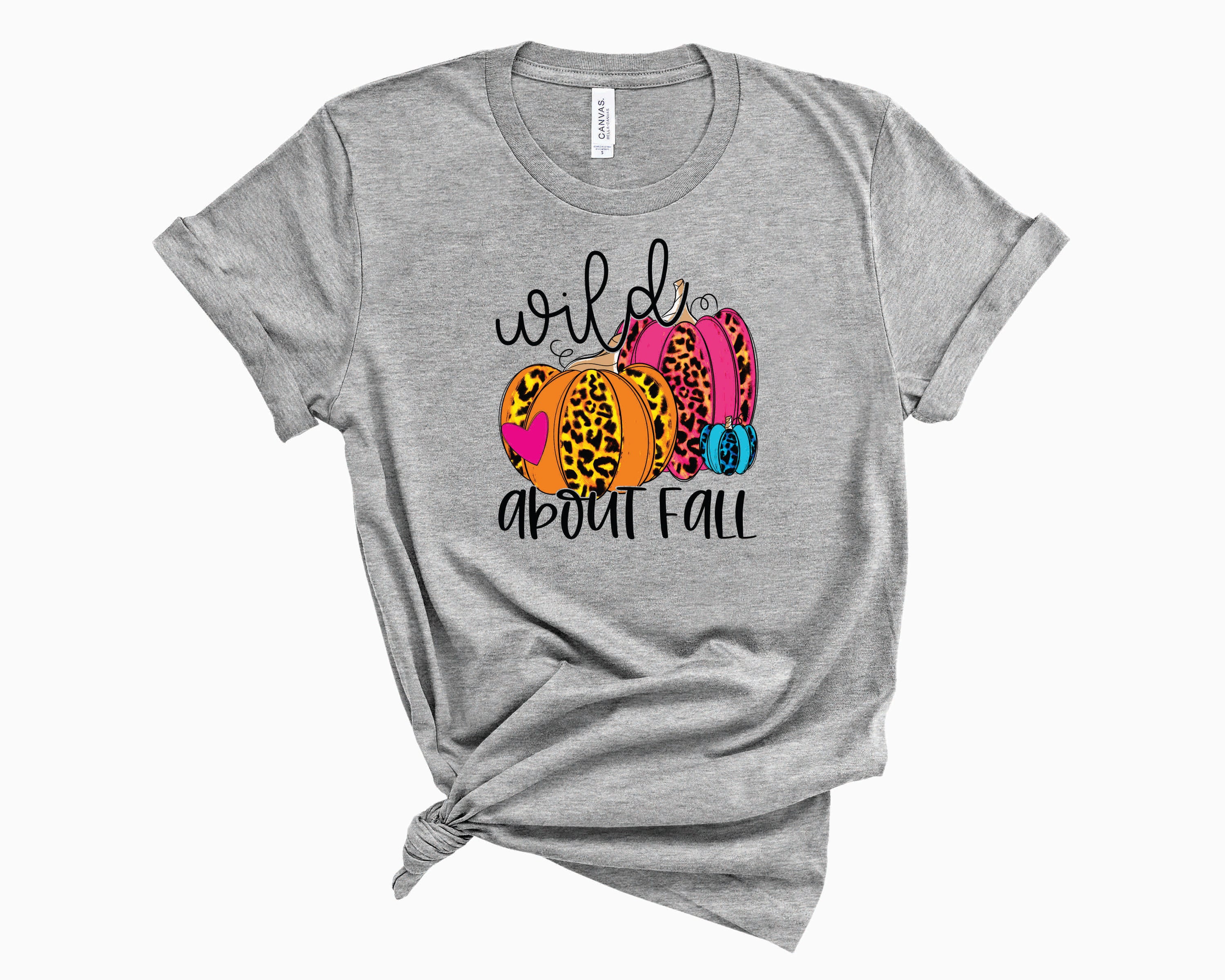 Wild About Fall Leopard Pumpkin Graphic Tee featuring a stylish leopard print pumpkin design on a soft unisex t-shirt.