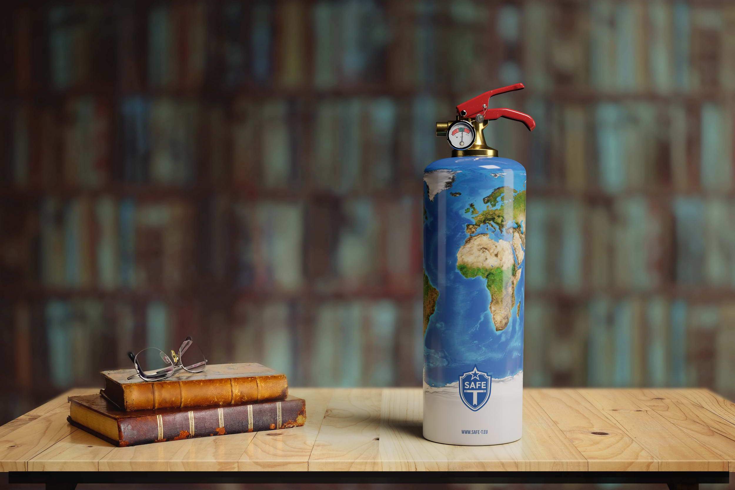 Safe-T WORLD fire extinguisher in a sleek cylindrical design, made of steel and brass, elegantly displayed in a tubular wrapper.