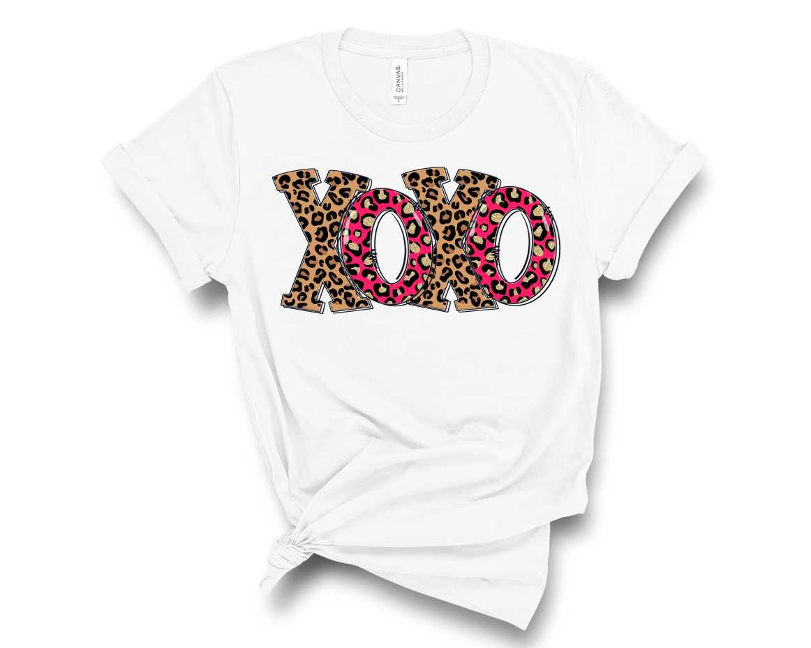 XOXO Pink Leopard Graphic Tee featuring a trendy pink leopard print design on a soft fabric, suitable for unisex wear.