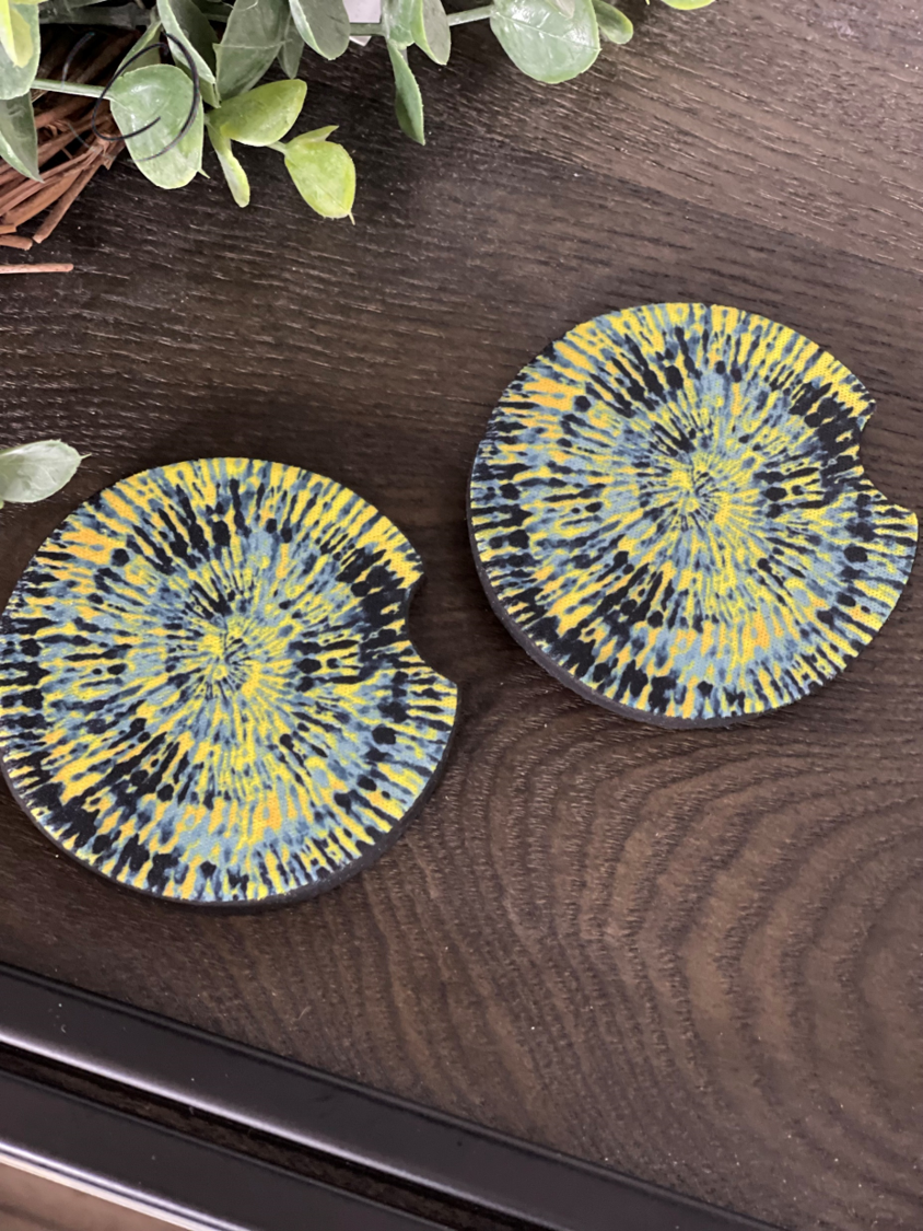 Yellow and blue tie dye neoprene car coasters, showcasing vibrant colors and a durable design, perfect for enhancing car interiors.