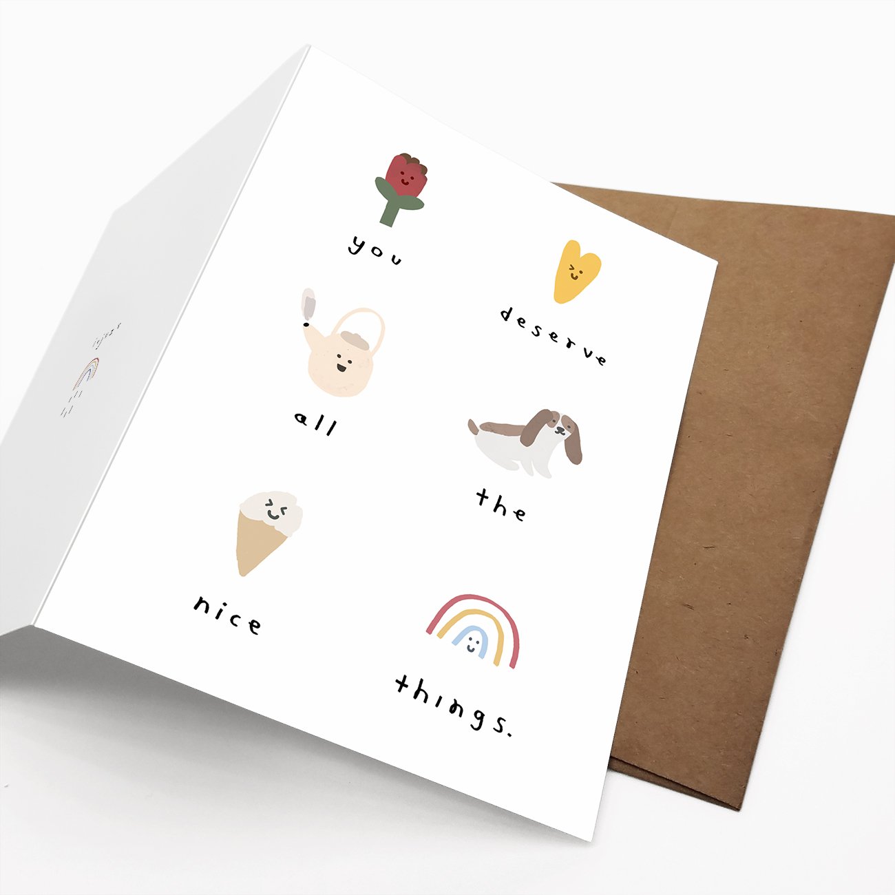 A beautifully designed greeting card titled 'You Deserve All The Nice Things', featuring a blank interior for personal messages, packaged with a Kraft envelope.