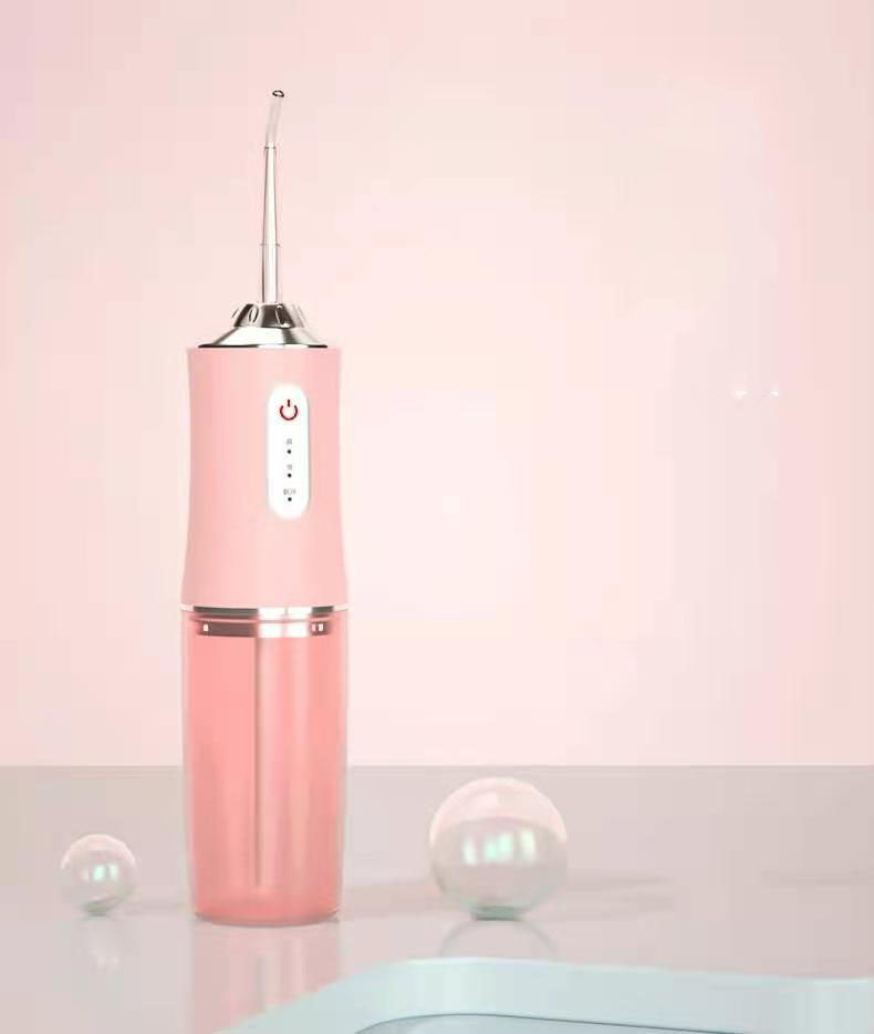 Portable 3 Modes Oral Irrigator in white, pink, and light green colors, showcasing its USB charging feature and compact design.