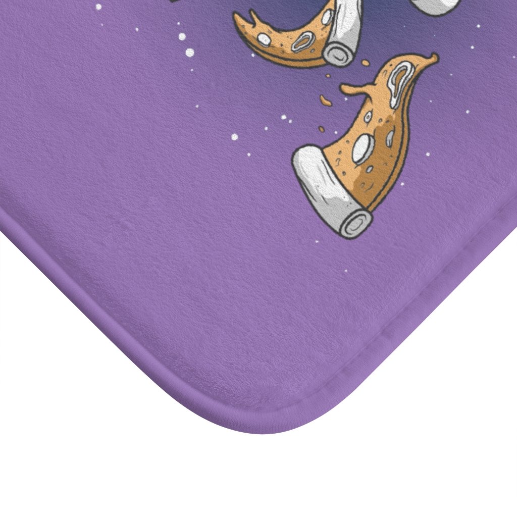 A colorful bath mat featuring an astronaut eating pizza in space, designed for safety and comfort.