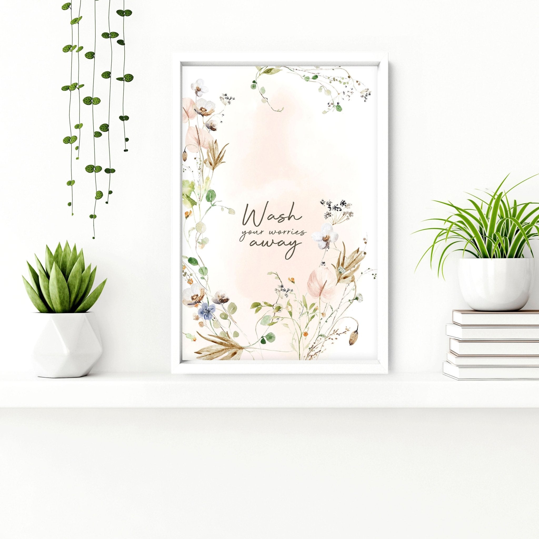 Set of 2 shabby chic floral wall art prints featuring delicate pink blooms on a soft background, perfect for bathroom decor.