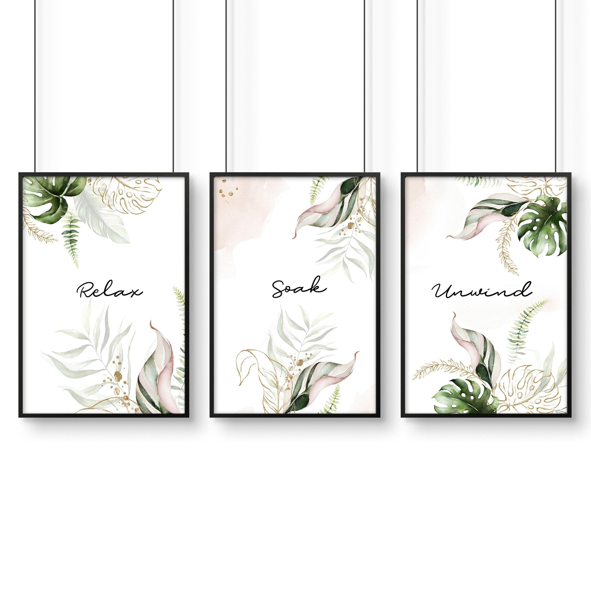 Set of 3 tropical wall art prints featuring palm leaves and exotic flowers in soft green, pink, and gold colors, perfect for bathroom decor.