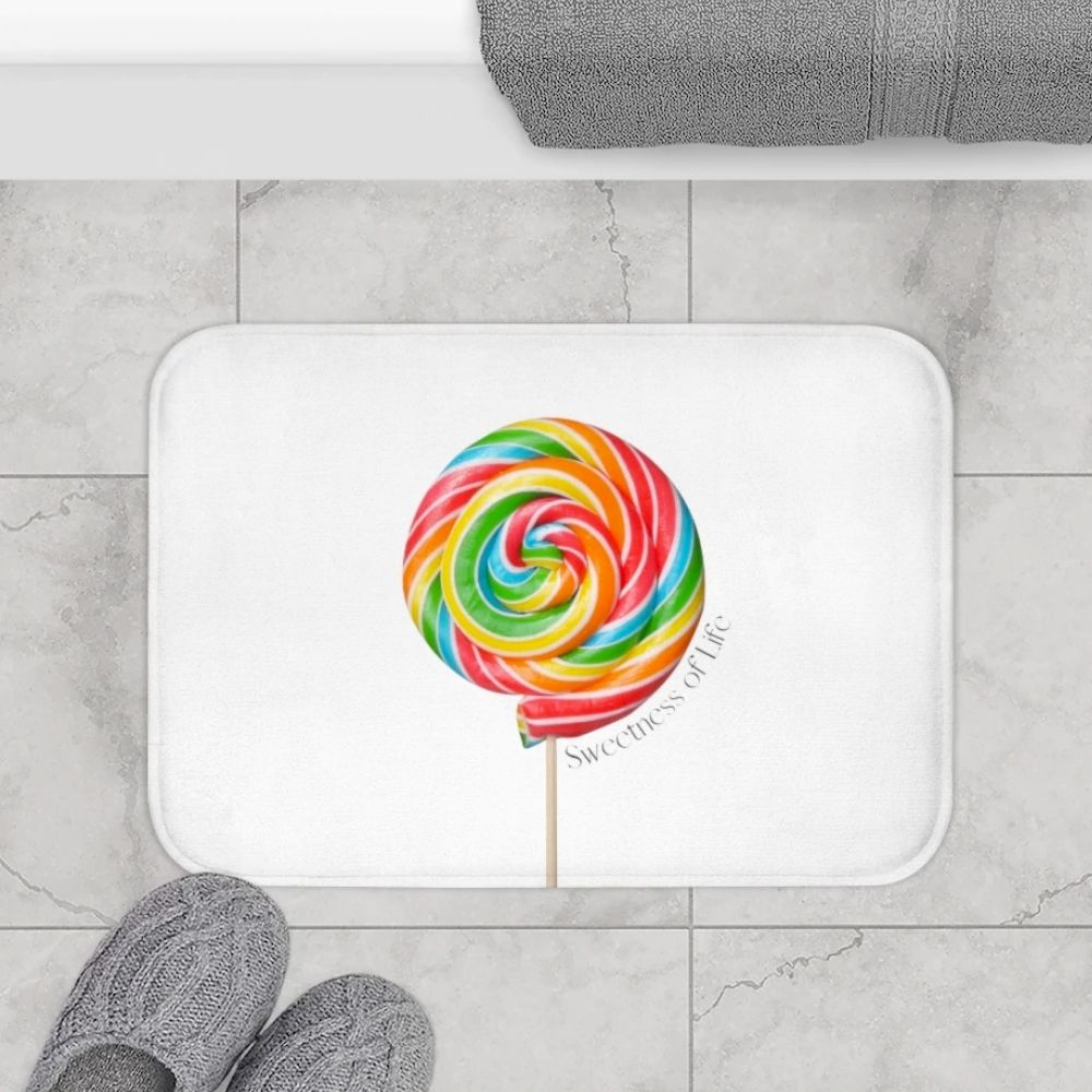 Lollipop Sweetness of Life Message Bath Mat in white with colorful design, featuring anti-slip backing and plush microfiber material.