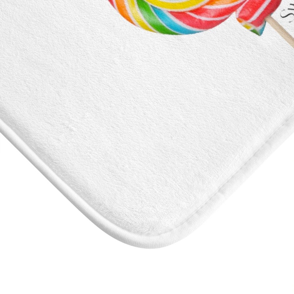 Lollipop Sweetness of Life Message Bath Mat in white with colorful design, featuring anti-slip backing and plush microfiber material.