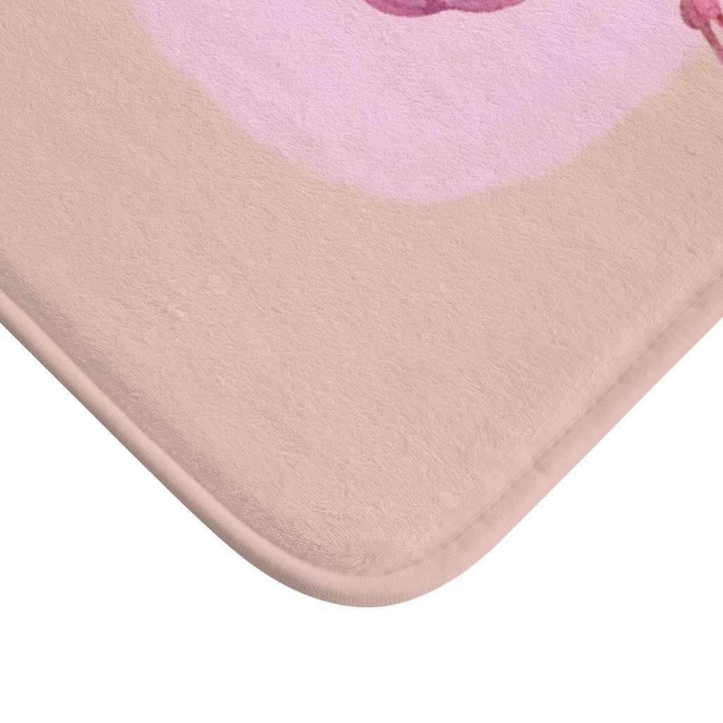 A vibrant Pink Flamingo Bath Mat featuring a playful flamingo design, made from soft microfiber with anti-slip backing for safety.