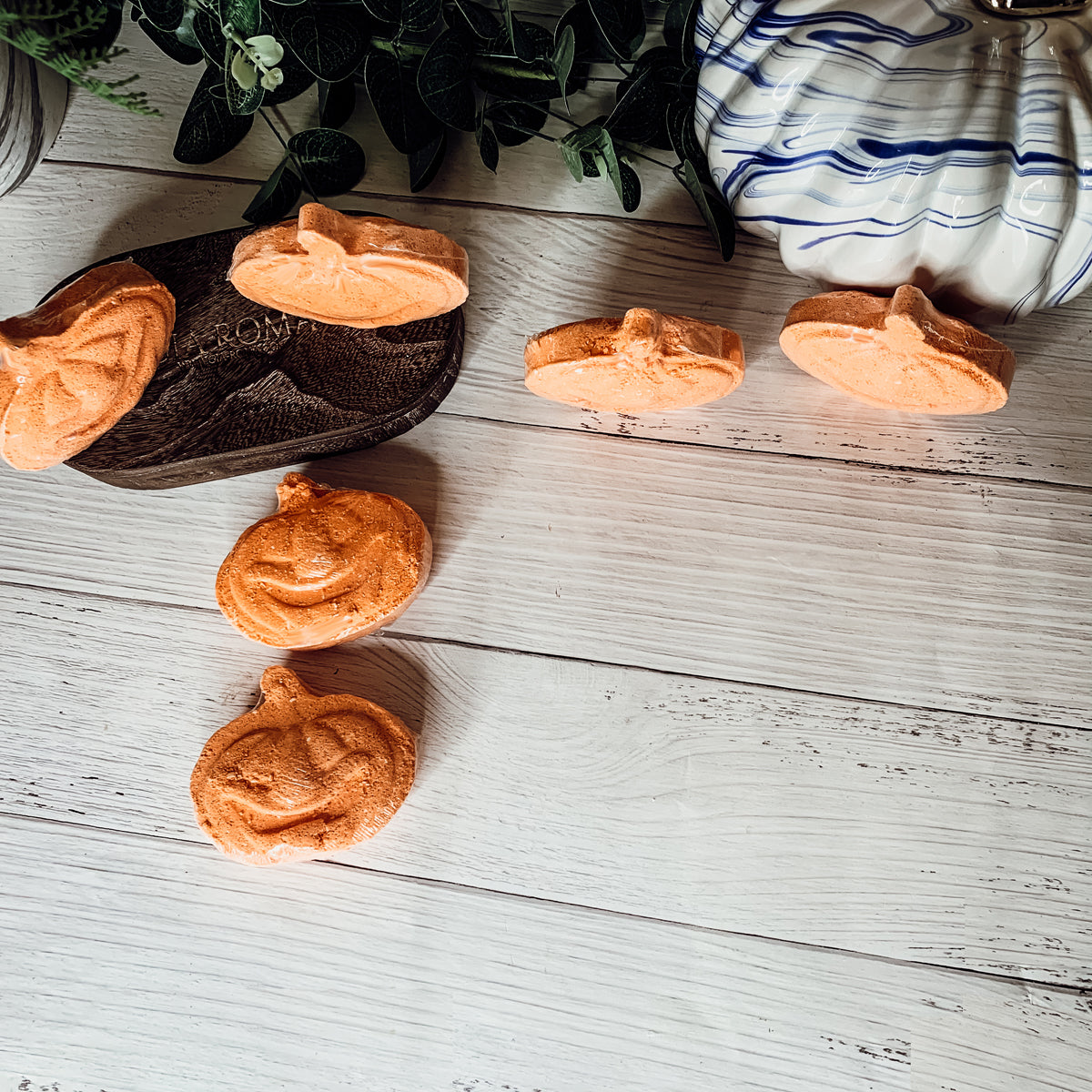 A vibrant Pumpkin Spice Bath Bomb, 3.5oz, featuring warm orange hues and a decorative design, perfect for fall-themed self-care.