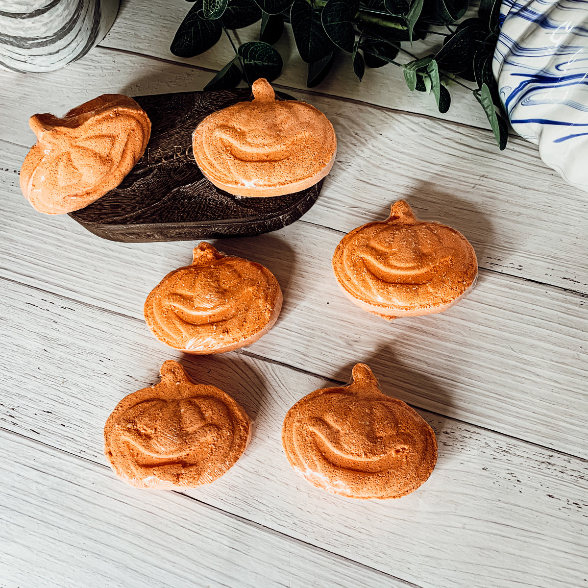 A vibrant Pumpkin Spice Bath Bomb, 3.5oz, featuring warm orange hues and a decorative design, perfect for fall-themed self-care.