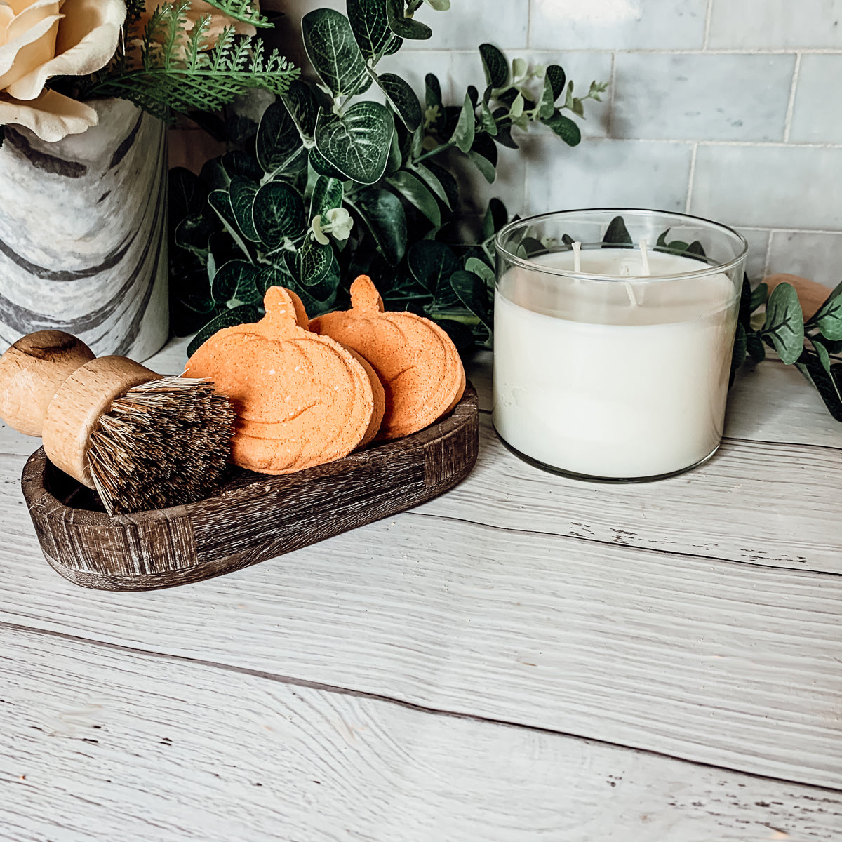 A vibrant Pumpkin Spice Bath Bomb, 3.5oz, featuring warm orange hues and a decorative design, perfect for fall-themed self-care.