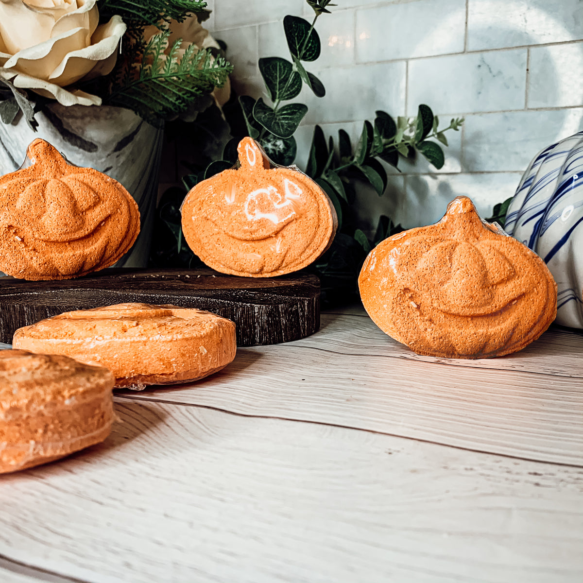 A vibrant Pumpkin Spice Bath Bomb, 3.5oz, featuring warm orange hues and a decorative design, perfect for fall-themed self-care.
