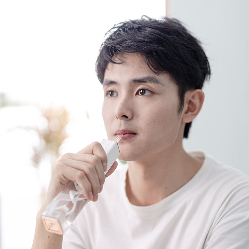 Water Jet Floss Dental Irrigator with USB charging, showcasing its sleek design and features for effective oral hygiene.