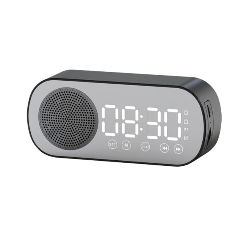 A sleek Music Alarm Clock with a mirror finish, featuring a large LED display, Bluetooth speaker, FM radio, and phone bracket, available in black, white, and pink.
