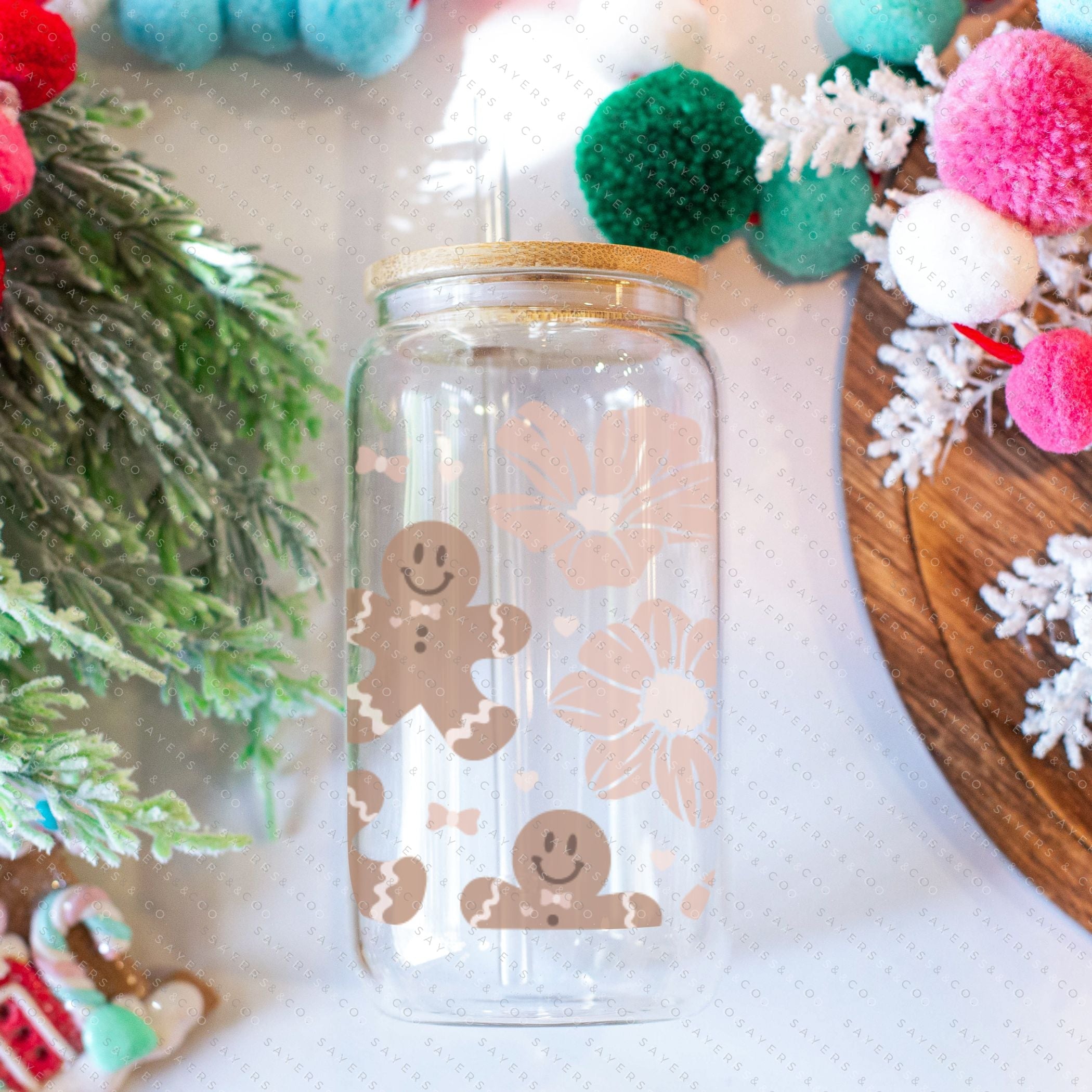 16oz Christmas Gingerbread Glass Cup featuring a bamboo lid and straw, perfect for festive drinks.