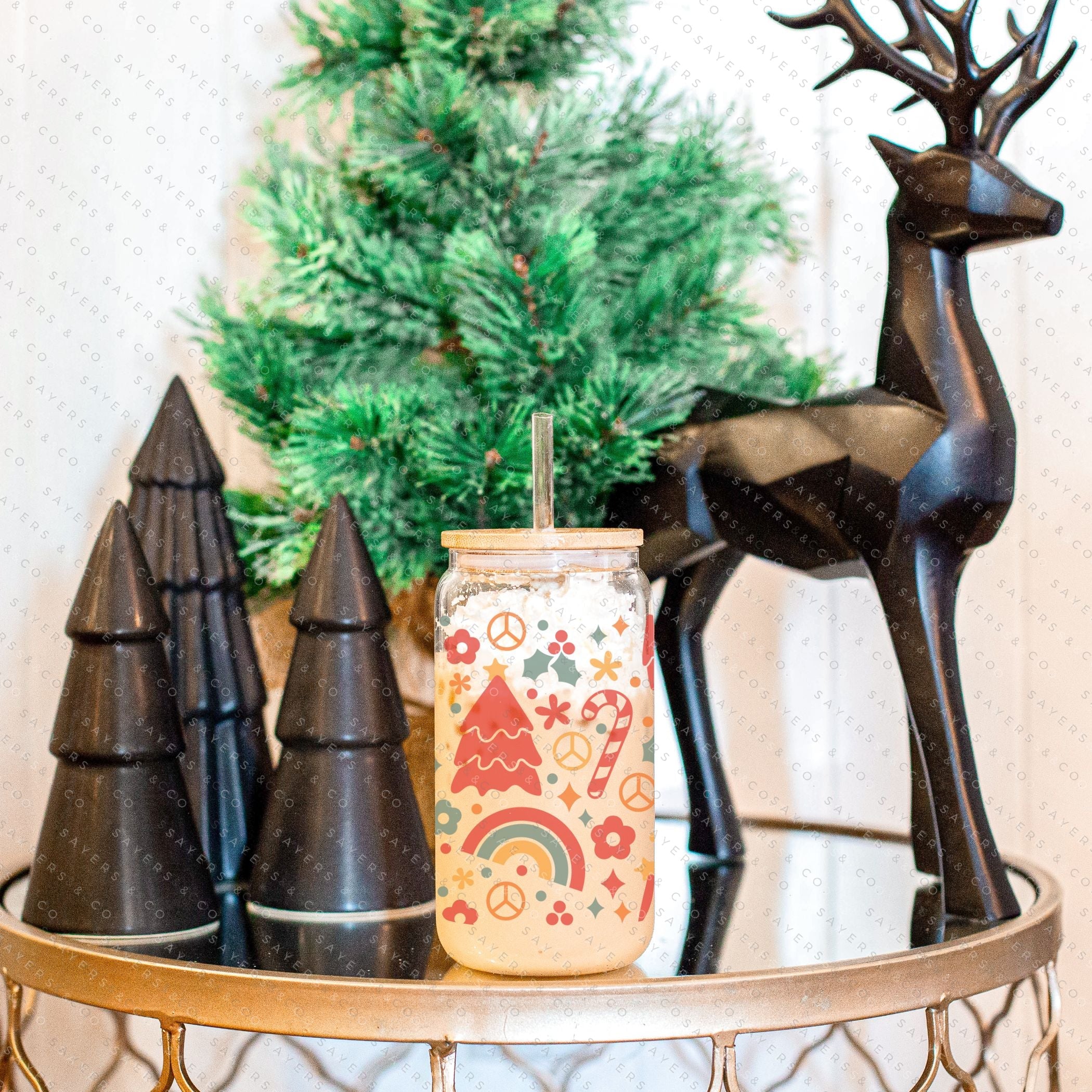 16oz Christmas Groove Glass Cup with Bamboo Lid and Straw, featuring a festive design perfect for holiday drinks.