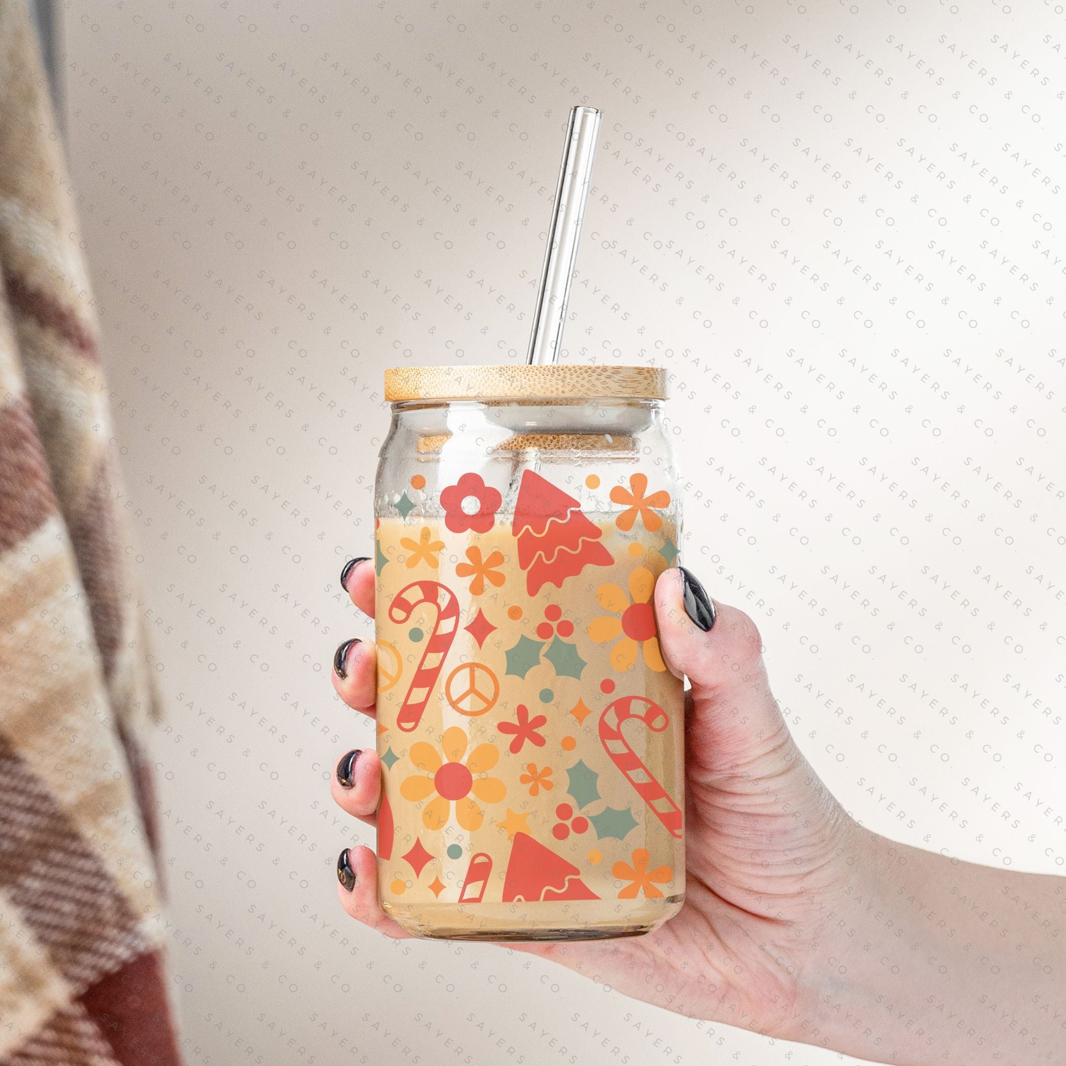 16oz Christmas Groove Glass Cup with Bamboo Lid and Straw, featuring a festive design perfect for holiday drinks.