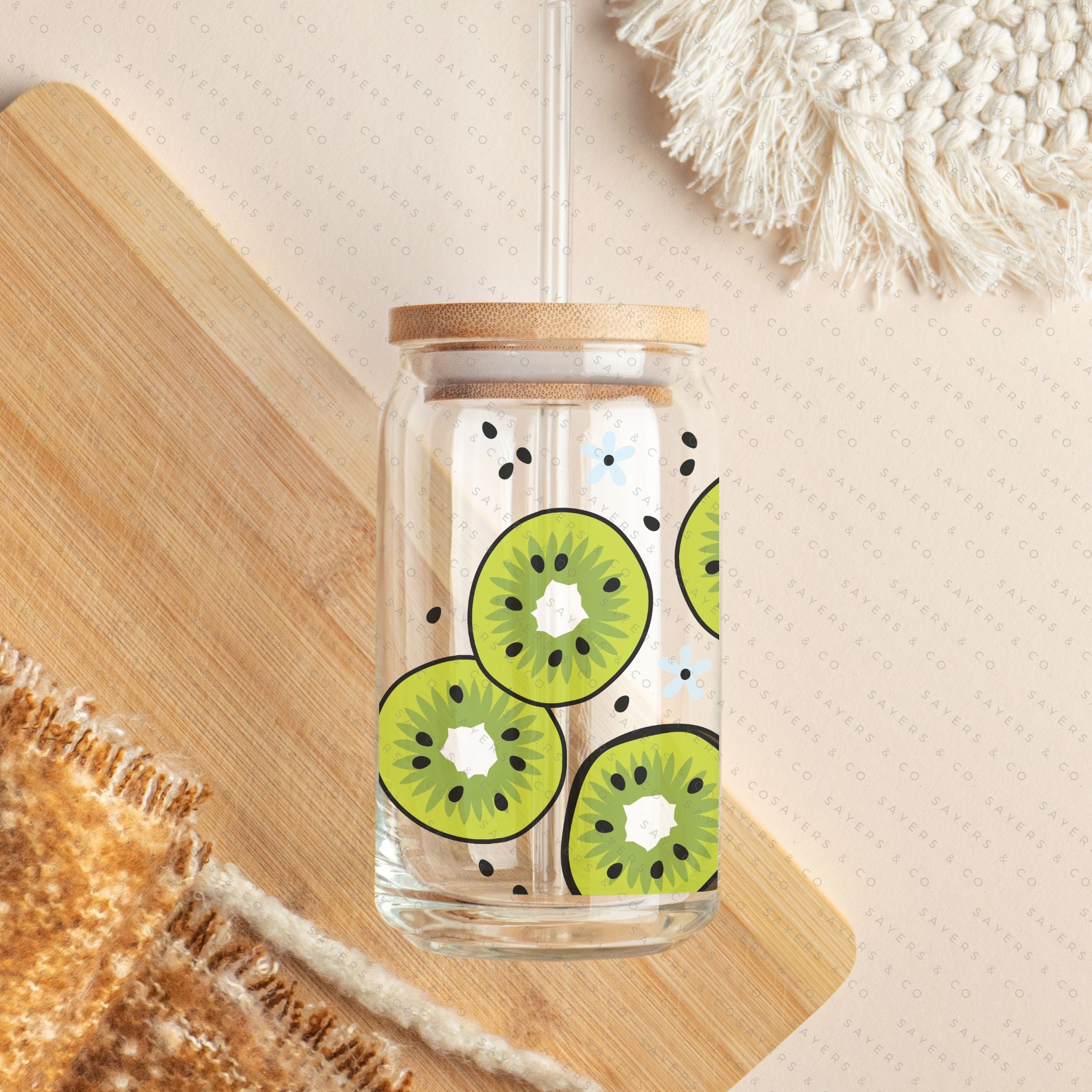 16oz Kiwi Krazy Glass Cup with bamboo lid and straw, featuring a vibrant kiwi design, perfect for beverages.