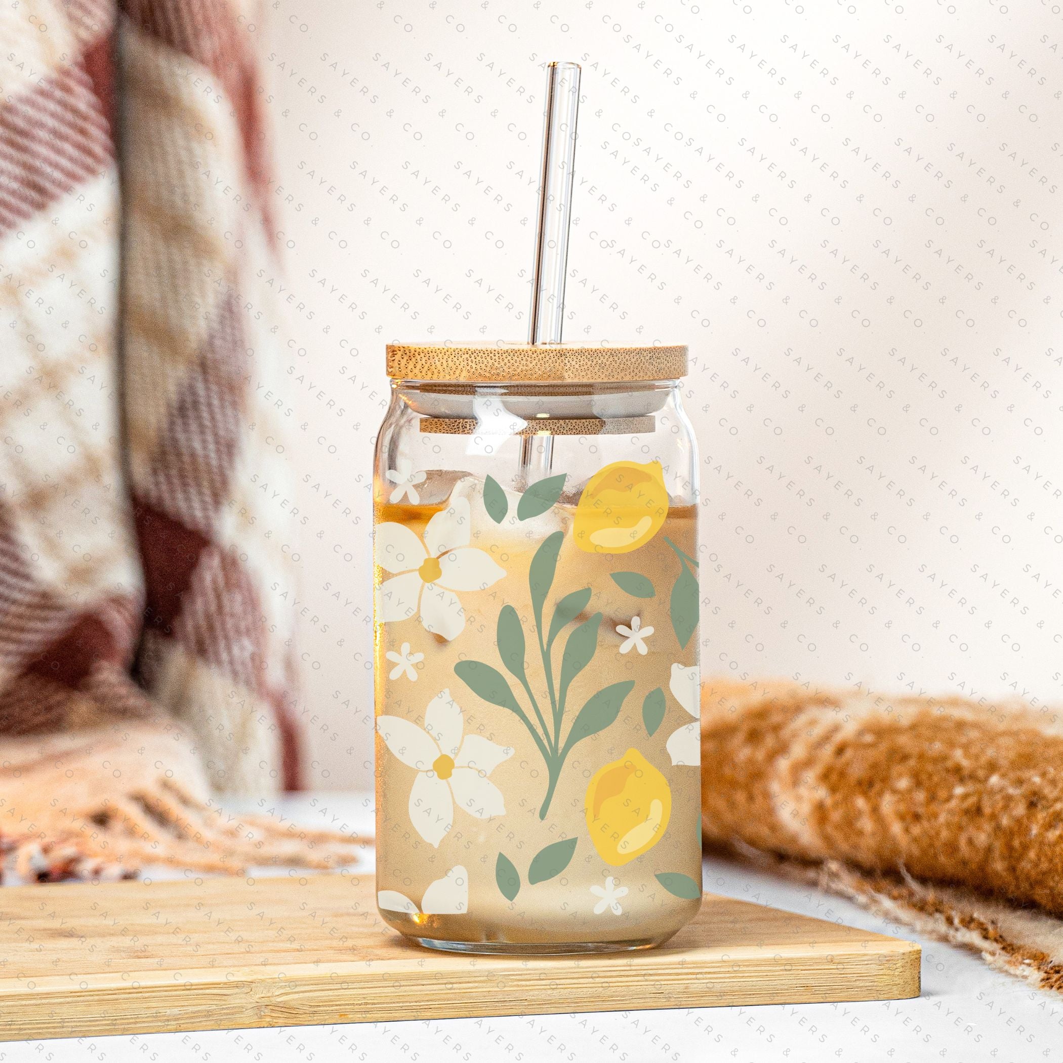16oz Lemon Bloom Glass Cup featuring a bamboo lid and straw, designed for stylish beverage enjoyment.