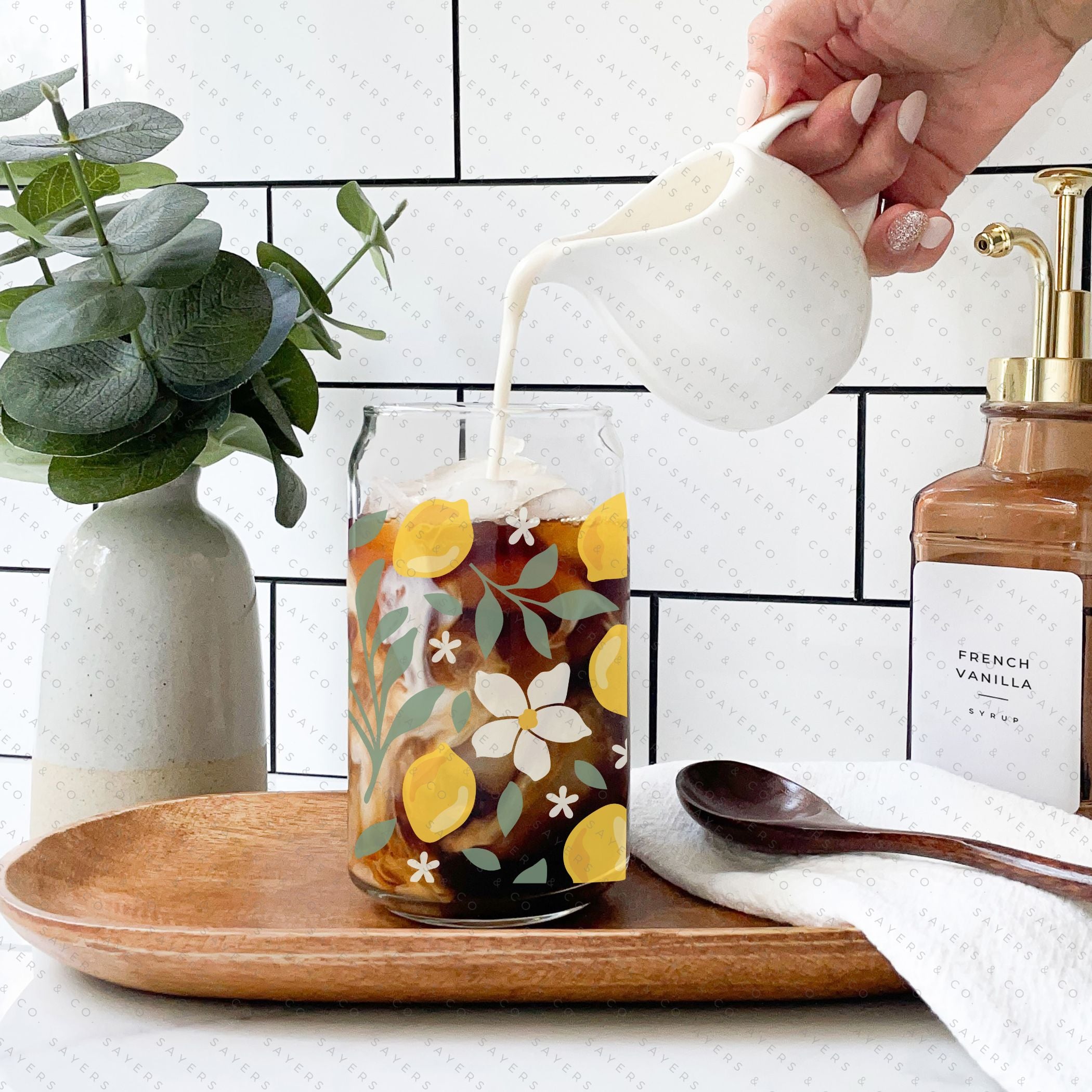 16oz Lemon Bloom Glass Cup featuring a bamboo lid and straw, designed for stylish beverage enjoyment.