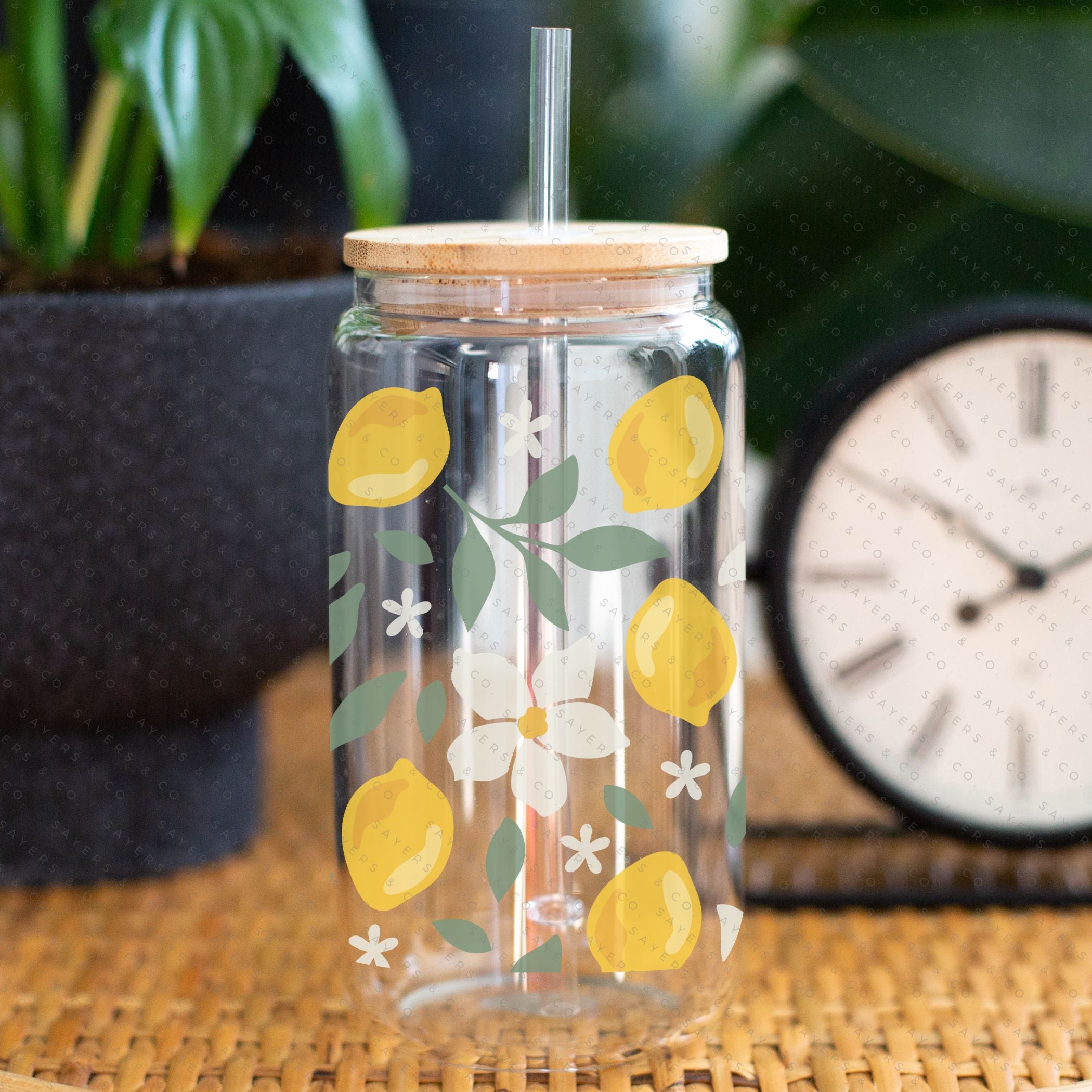 16oz Lemon Bloom Glass Cup featuring a bamboo lid and straw, designed for stylish beverage enjoyment.