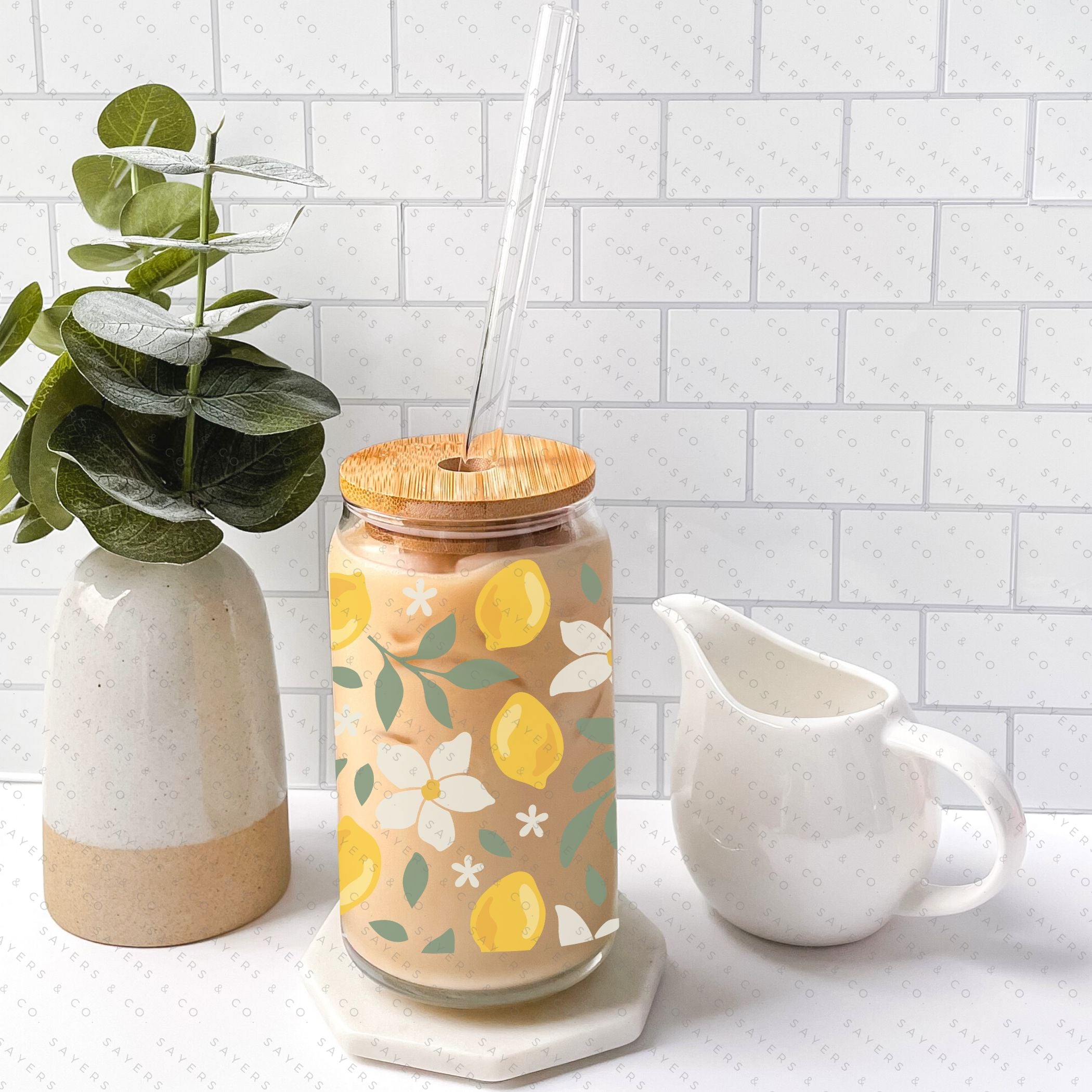 16oz Lemon Bloom Glass Cup featuring a bamboo lid and straw, designed for stylish beverage enjoyment.