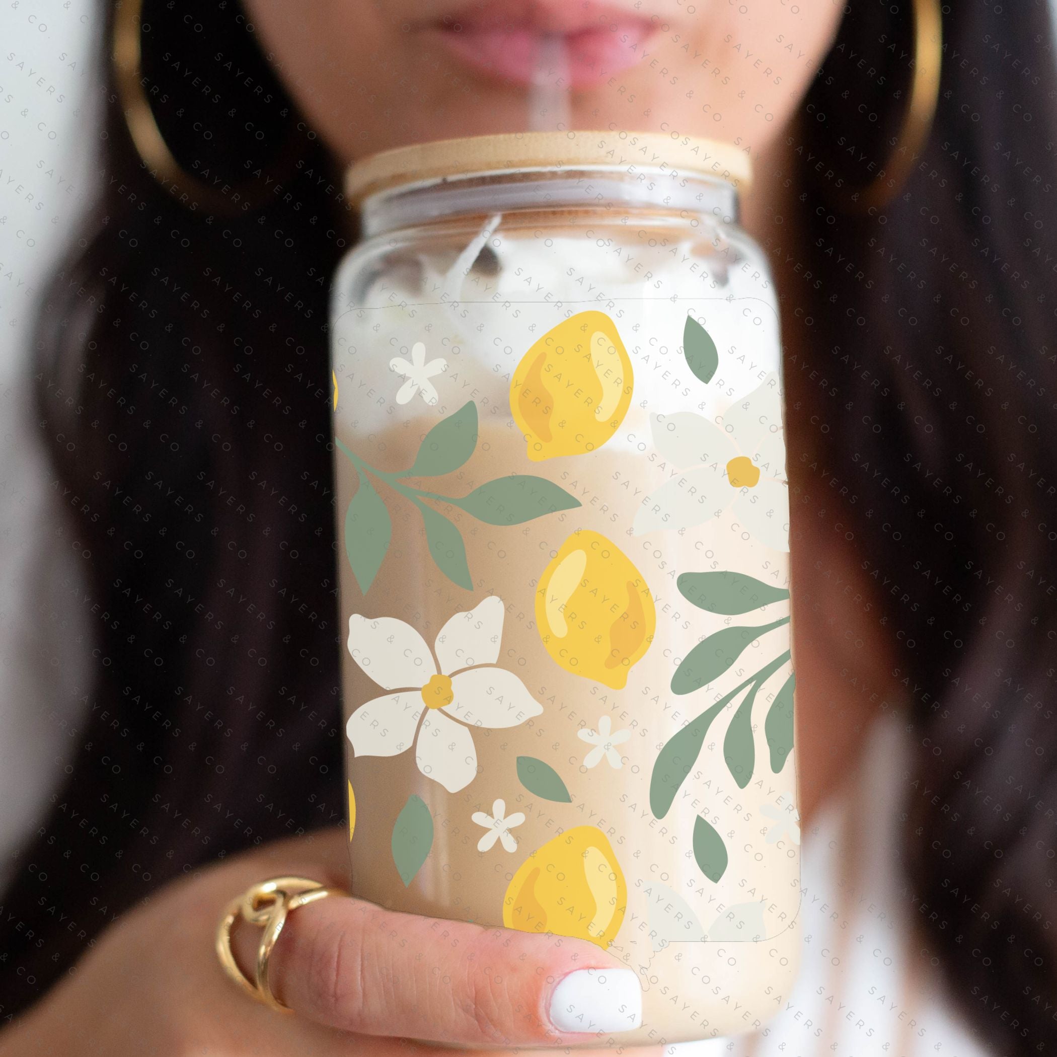 16oz Lemon Bloom Glass Cup featuring a bamboo lid and straw, designed for stylish beverage enjoyment.