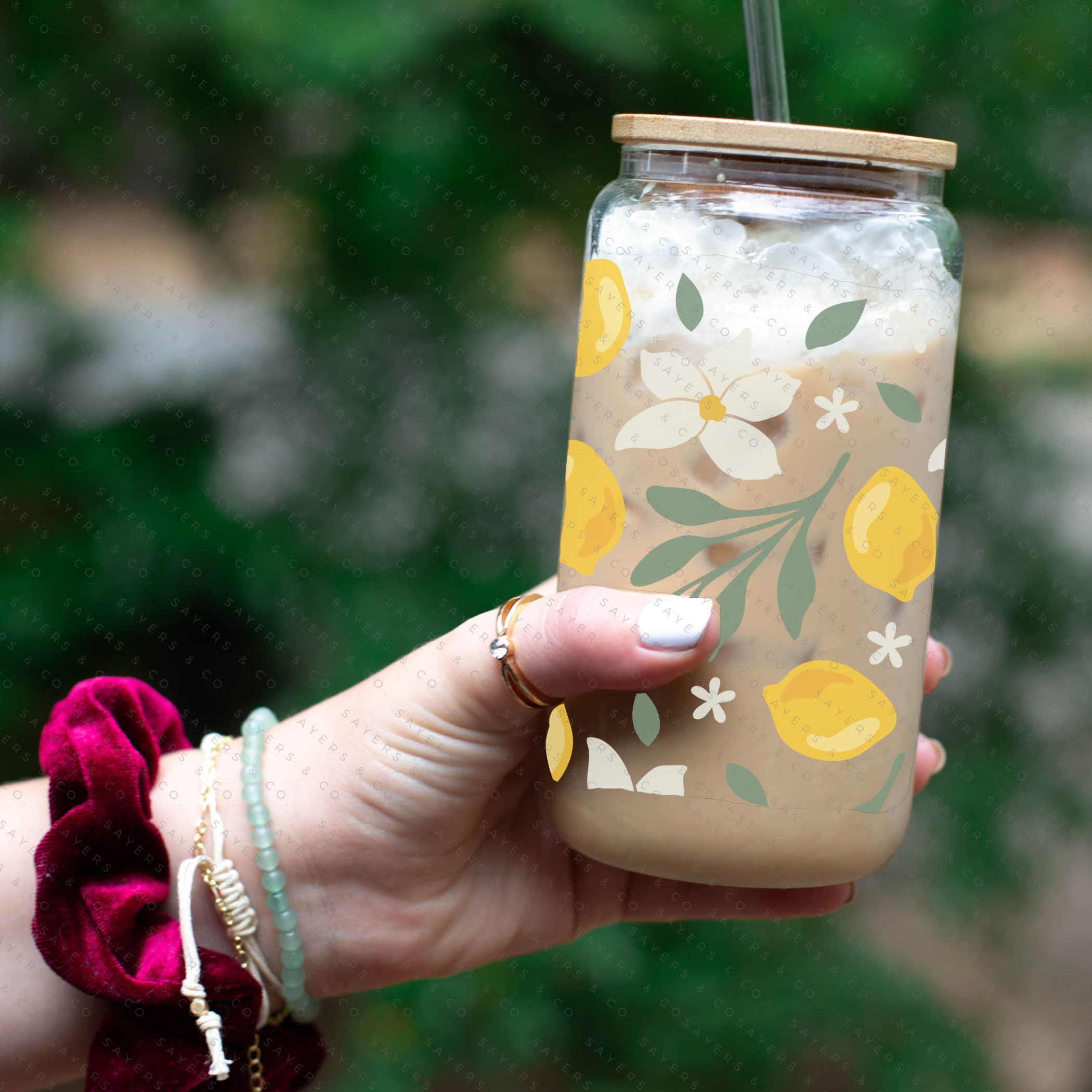 16oz Lemon Bloom Glass Cup featuring a bamboo lid and straw, designed for stylish beverage enjoyment.