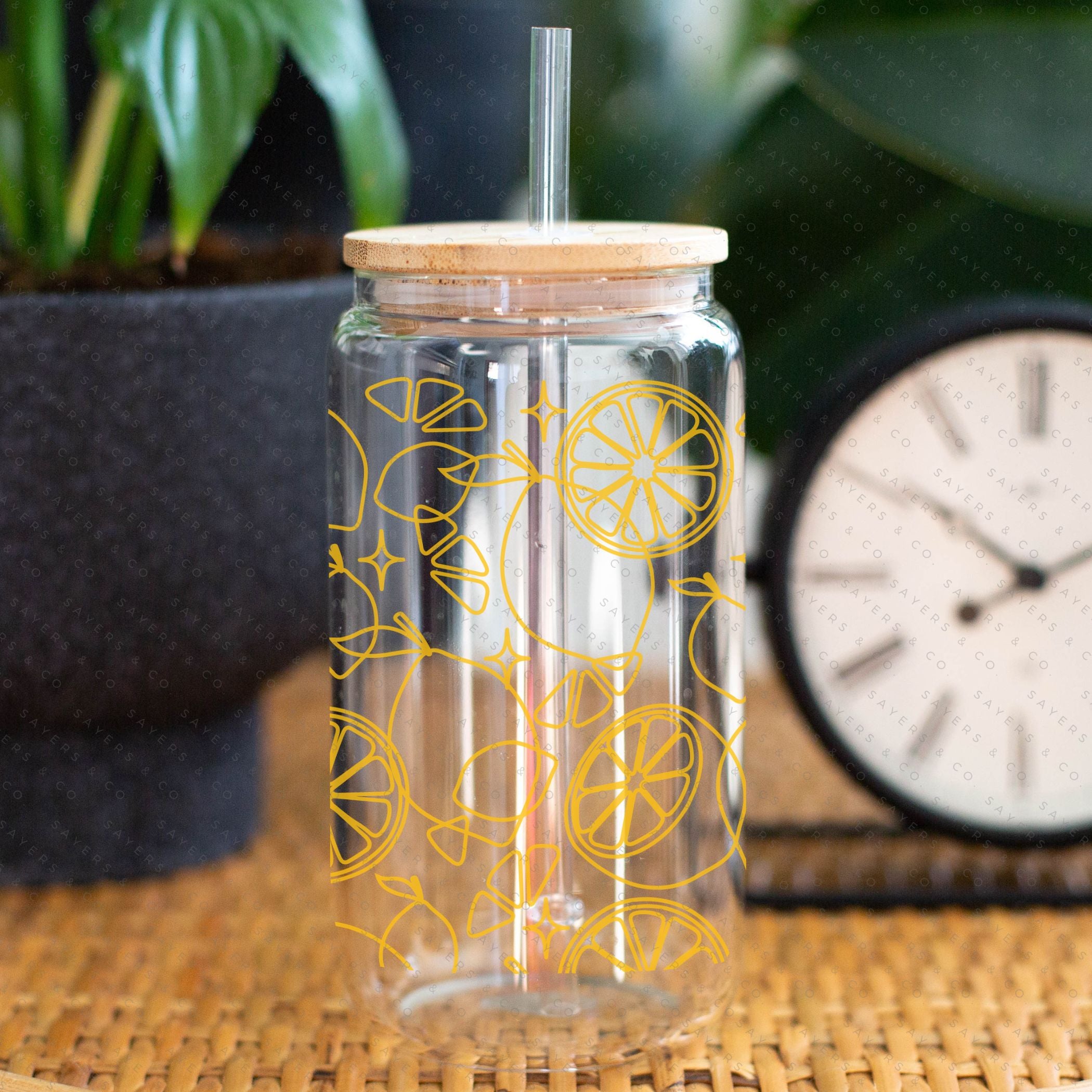 16oz Lemon Lock Glass Cup with Bamboo Lid and Straw, featuring a vibrant lemon design, perfect for beverages.