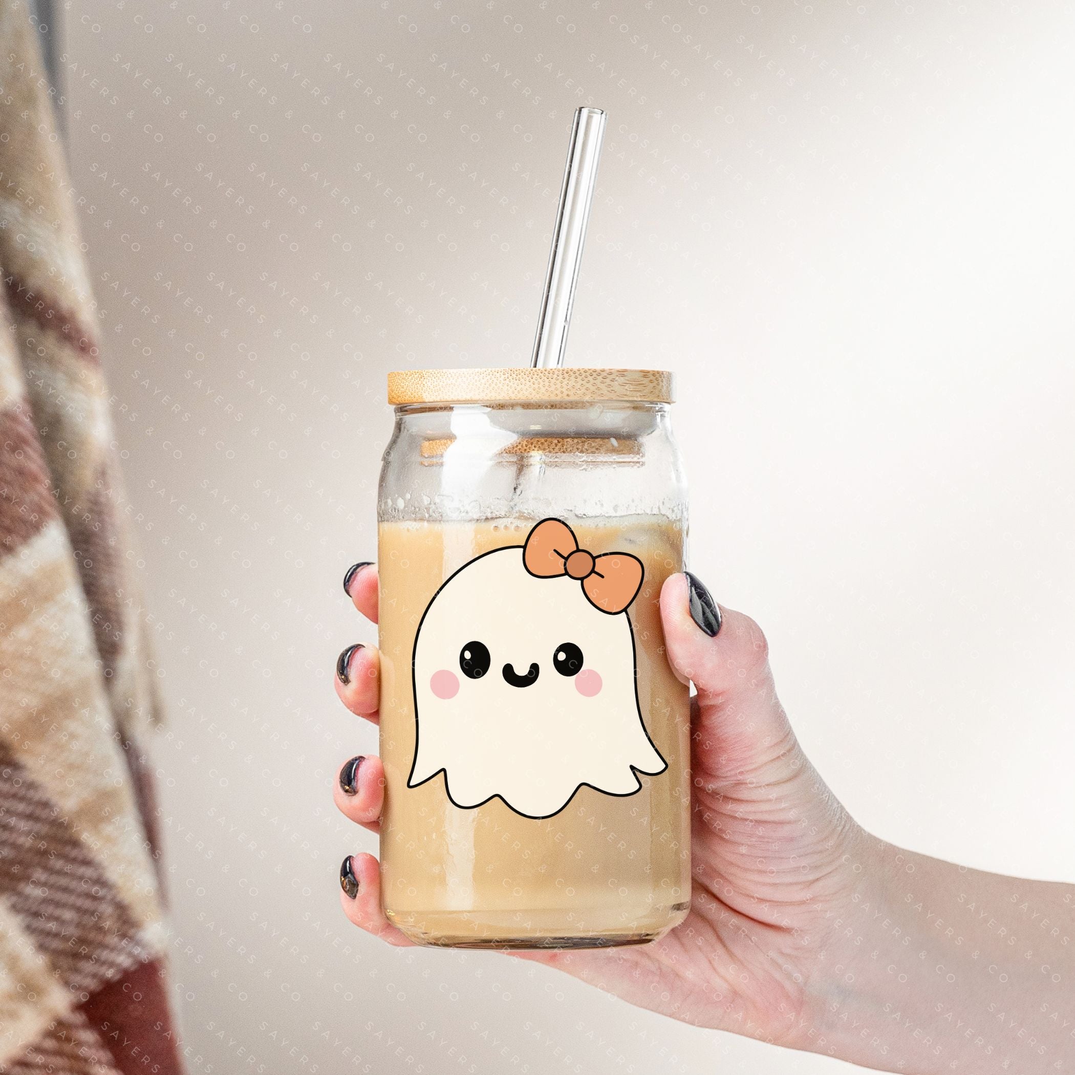 16oz Lil Boo Thang Glass Cup with bamboo lid and straw, featuring a spooky design perfect for Halloween.