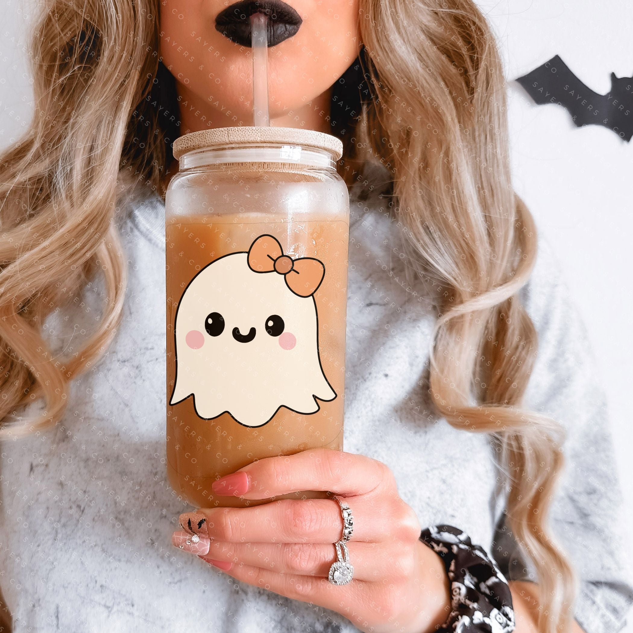 16oz Lil Boo Thang Glass Cup with bamboo lid and straw, featuring a spooky design perfect for Halloween.
