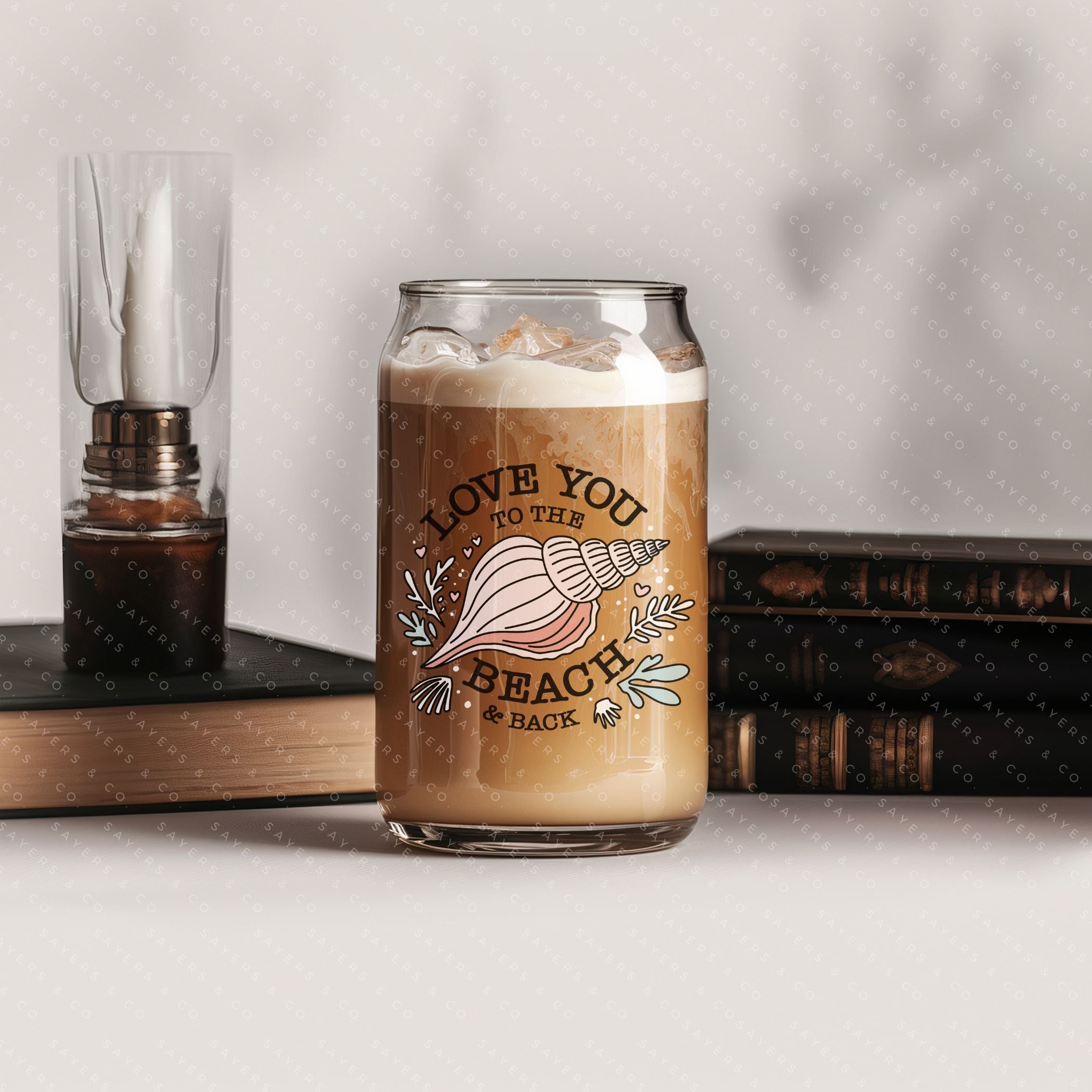 16oz Love You to the Beach Glass Cup with bamboo lid and straw, showcasing a floral design perfect for summer drinks.