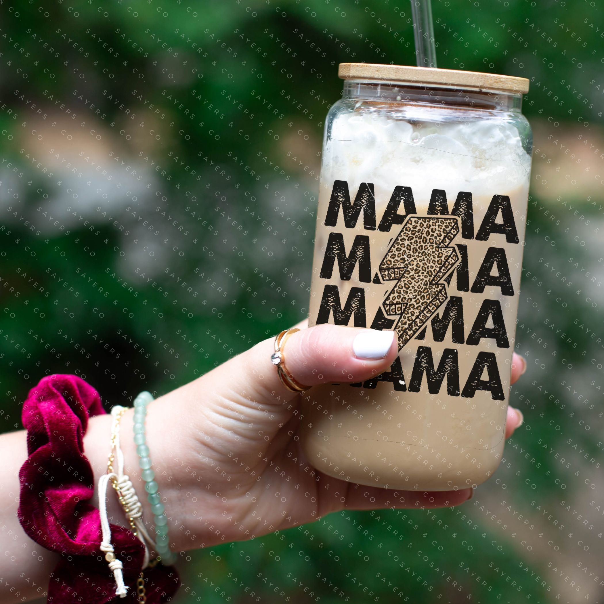 16oz Mama Leopard Bolt Glass Cup with bamboo lid and straw, featuring a stylish leopard design, perfect for drinks.