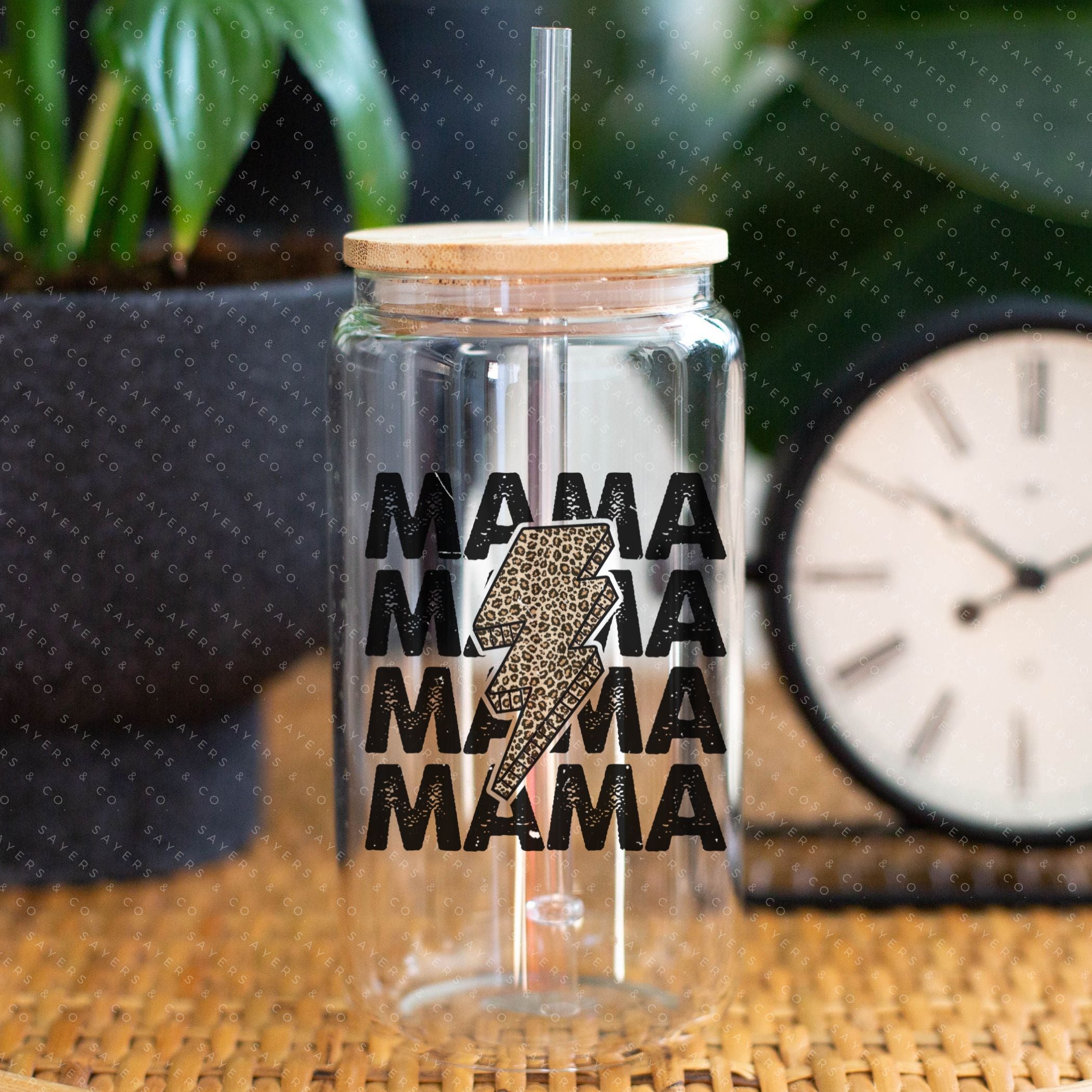 16oz Mama Leopard Bolt Glass Cup with bamboo lid and straw, featuring a stylish leopard design, perfect for drinks.
