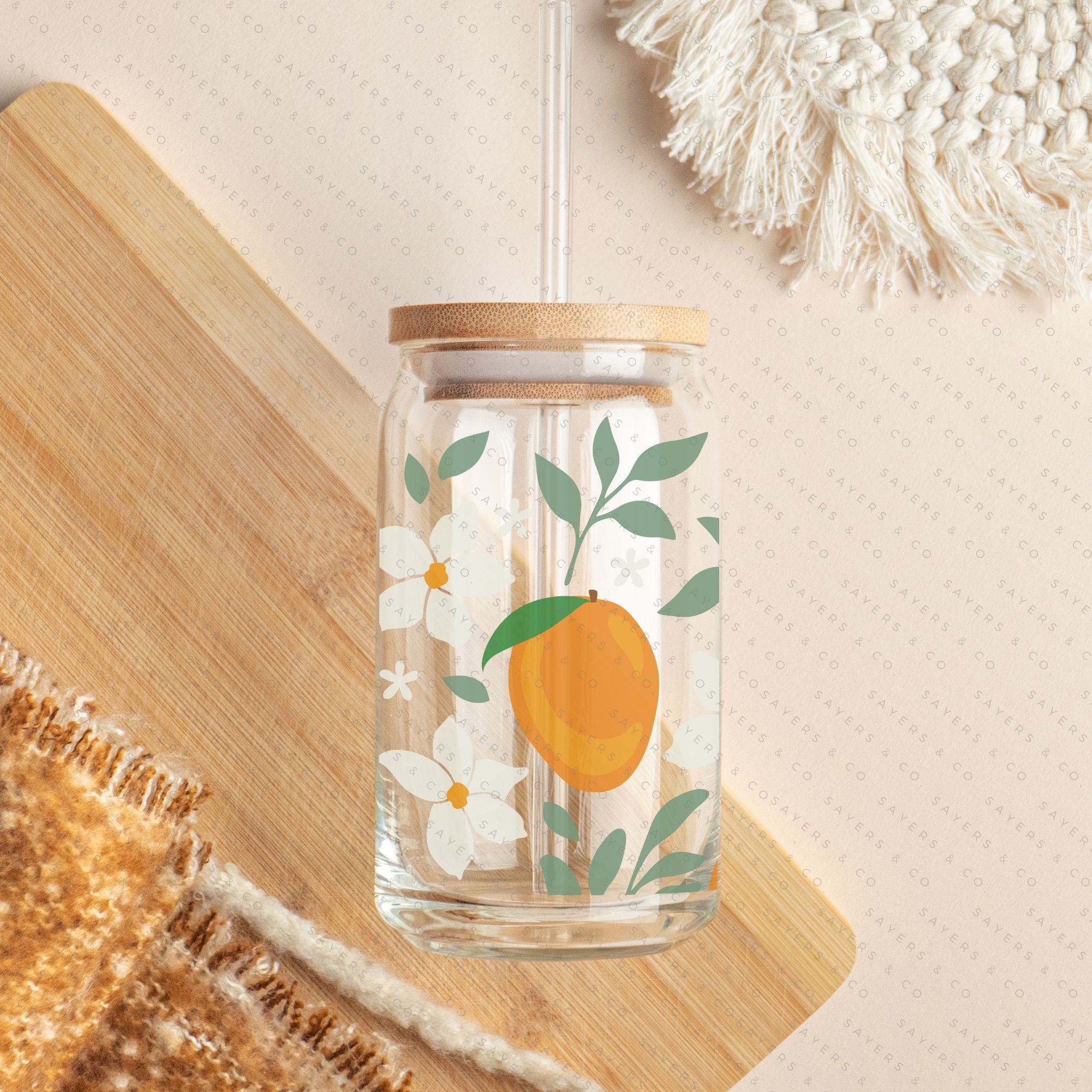 16oz Modern Mangos Glass Cup with bamboo lid and straw, showcasing a vibrant mango design, perfect for various beverages.
