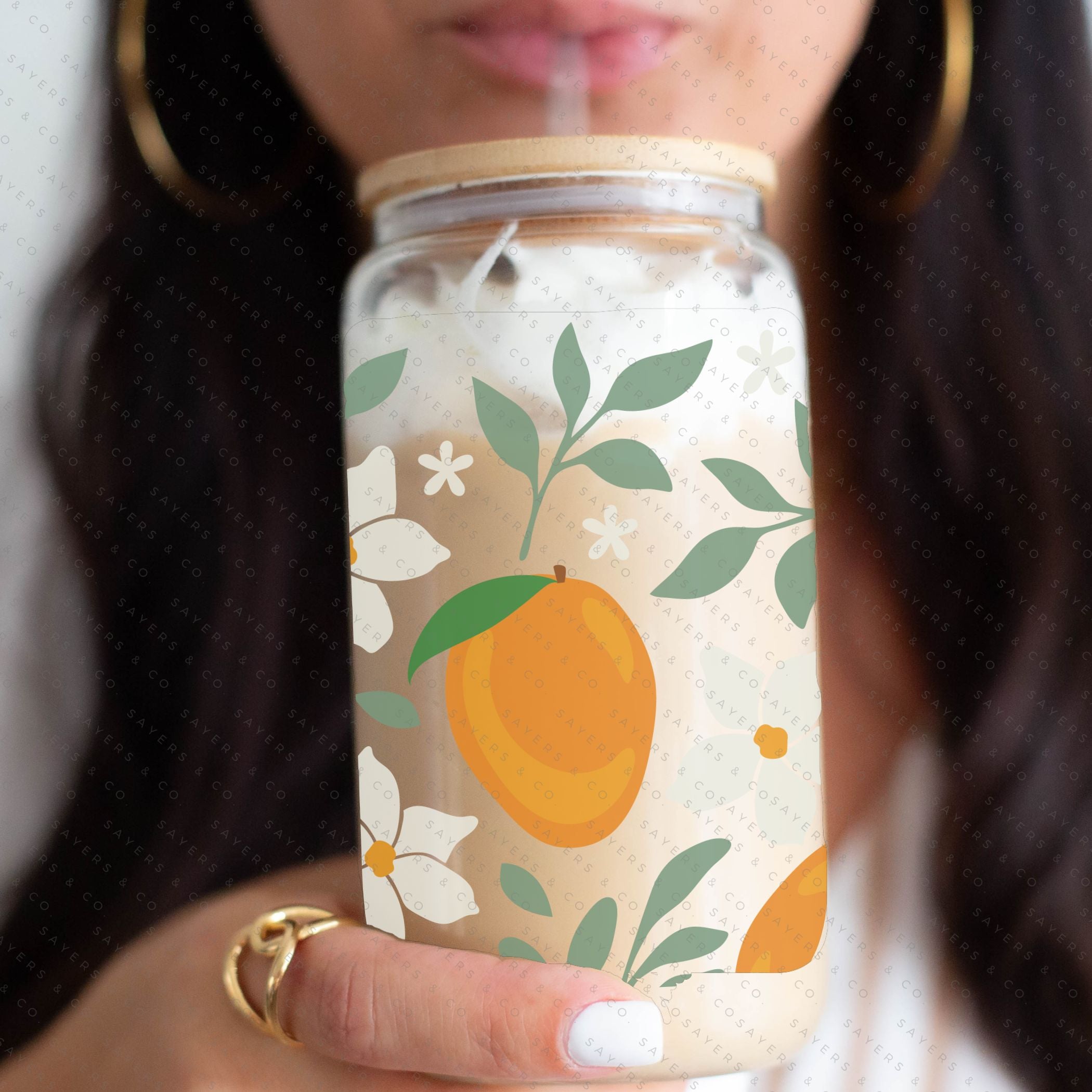 16oz Modern Mangos Glass Cup with bamboo lid and straw, showcasing a vibrant mango design, perfect for various beverages.