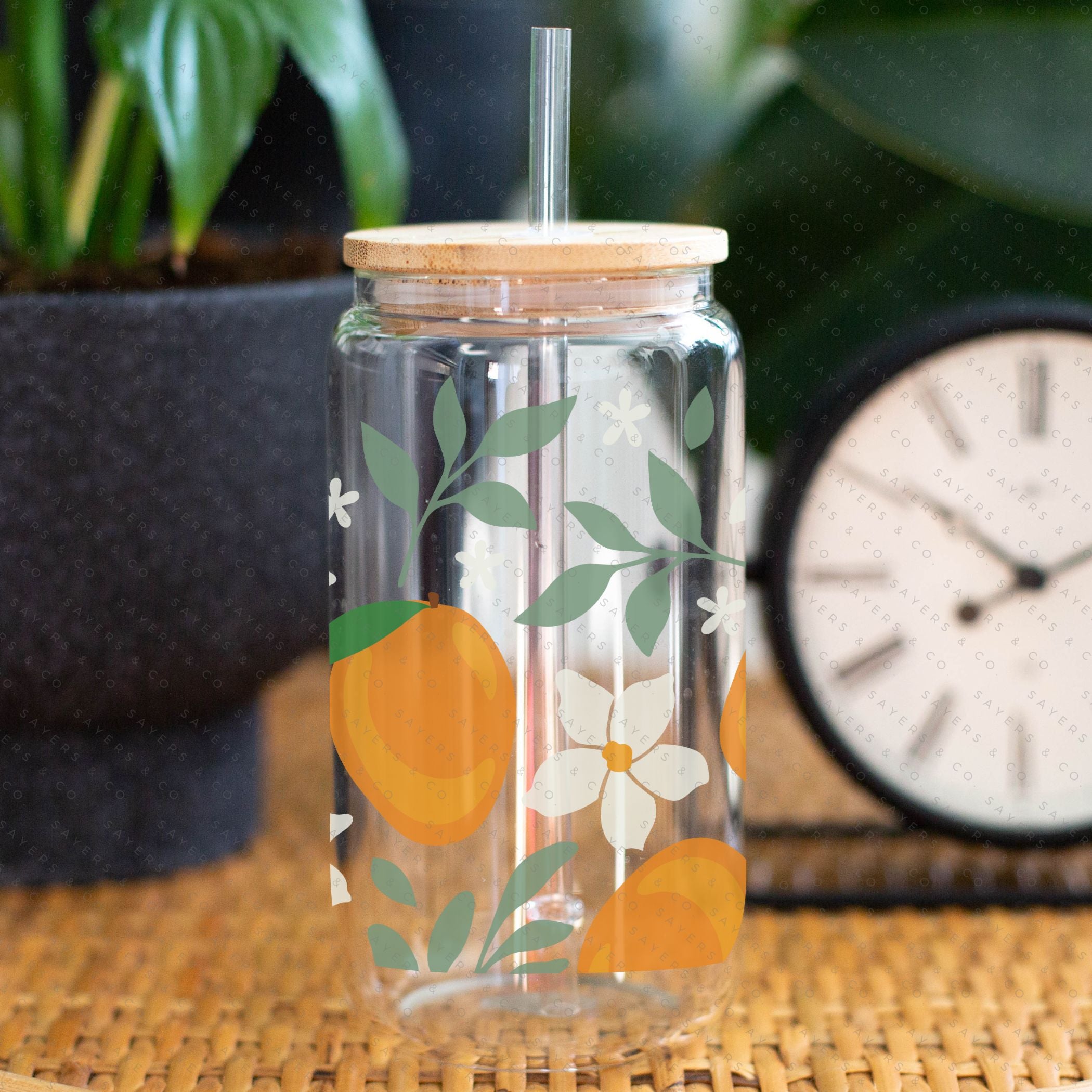 16oz Modern Mangos Glass Cup with bamboo lid and straw, showcasing a vibrant mango design, perfect for various beverages.