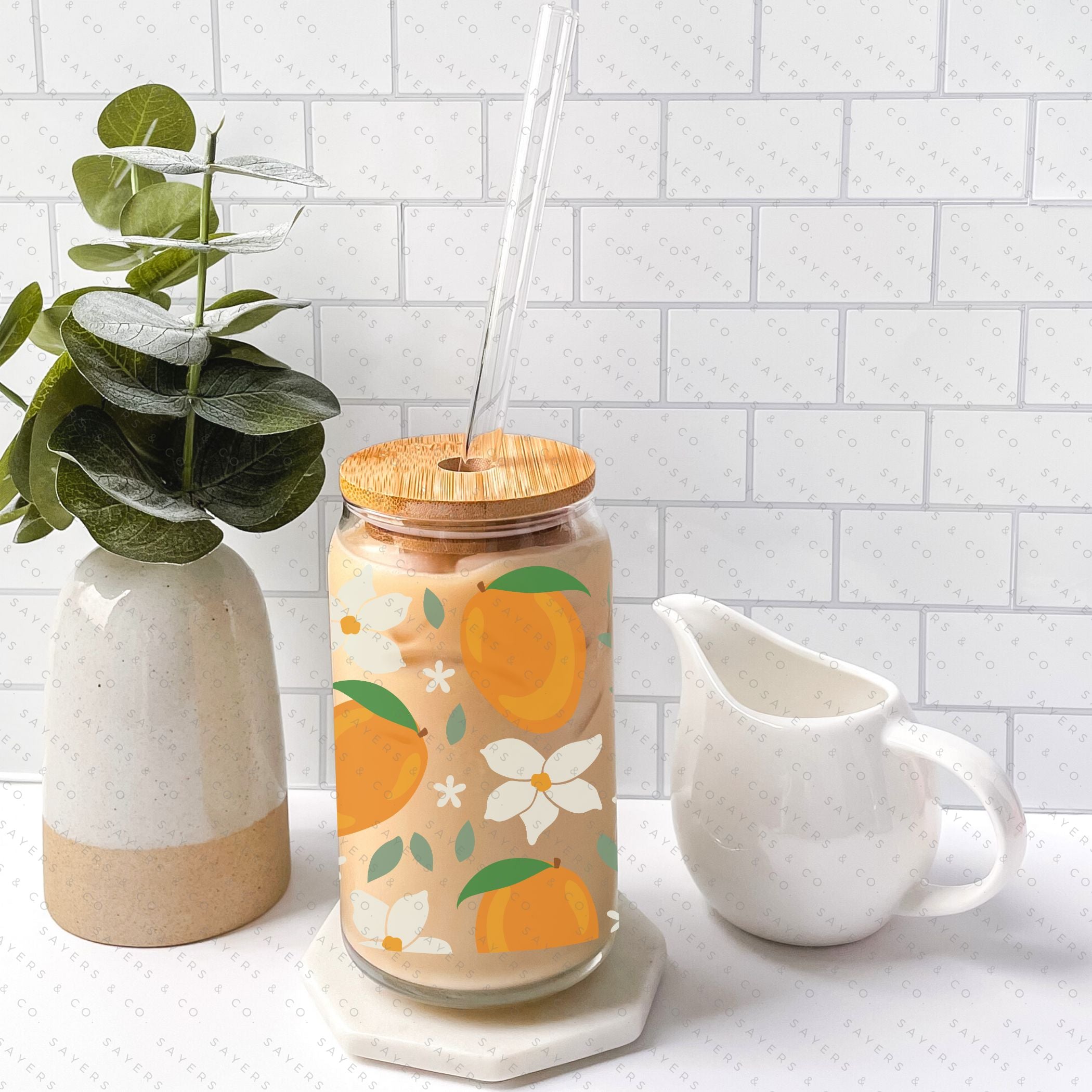 16oz Modern Mangos Glass Cup with bamboo lid and straw, showcasing a vibrant mango design, perfect for various beverages.