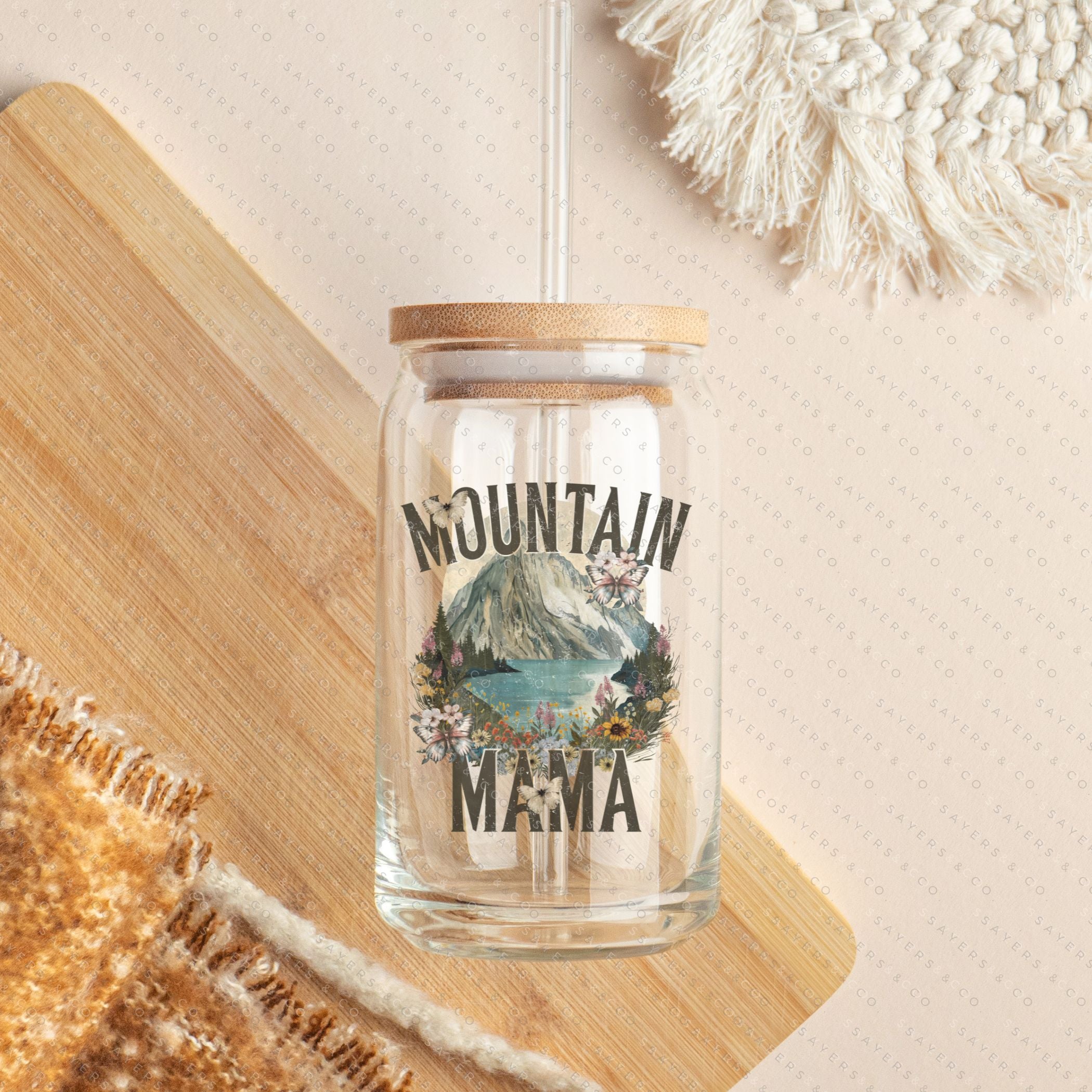 16oz Mountain Mama Glass Cup with Bamboo Lid and Straw, showcasing a clear glass design with a bamboo lid and a clear straw, perfect for beverages.