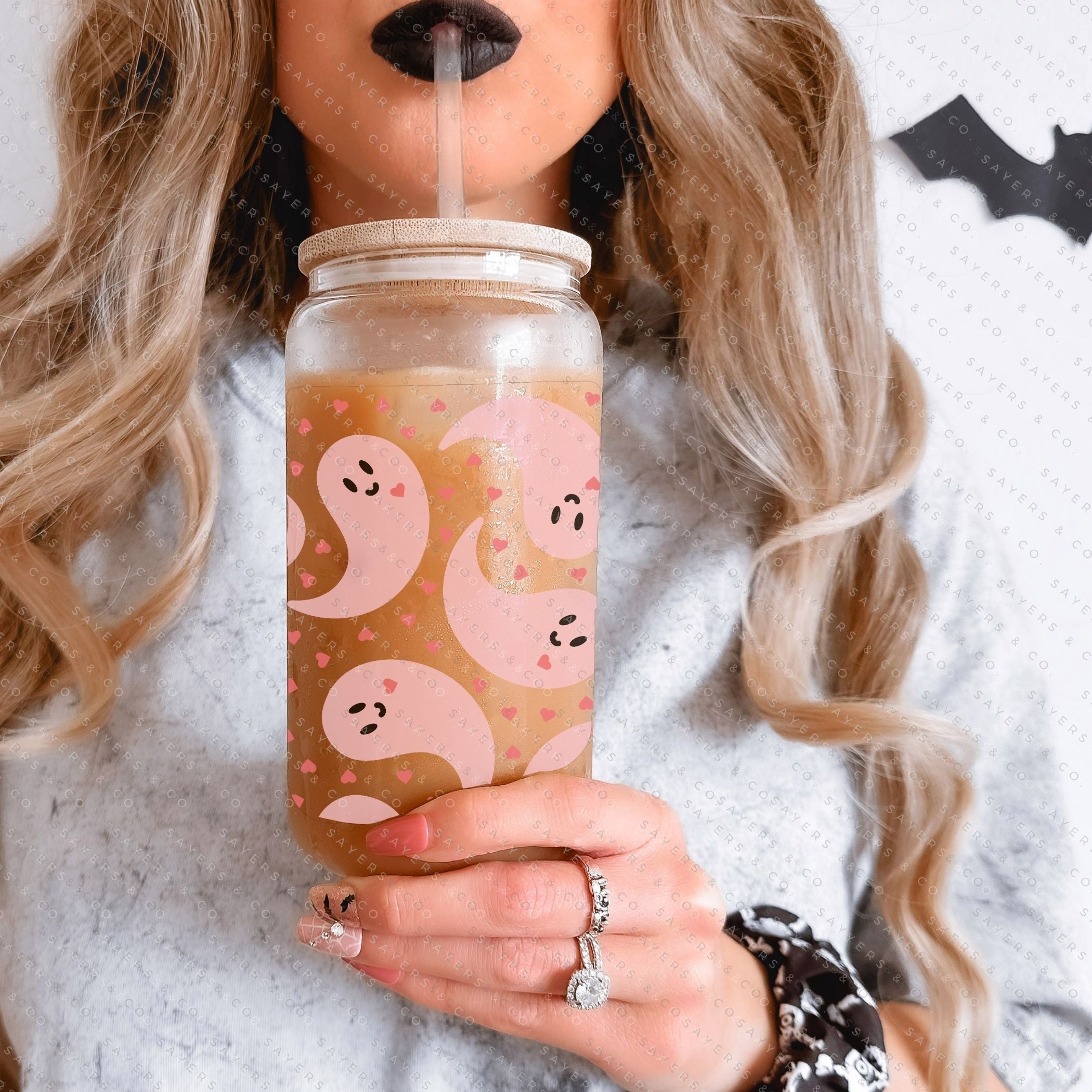 16oz Never Ghost U Glass Cup with bamboo lid and straw, showcasing a unique sublimated design, perfect for various beverages.