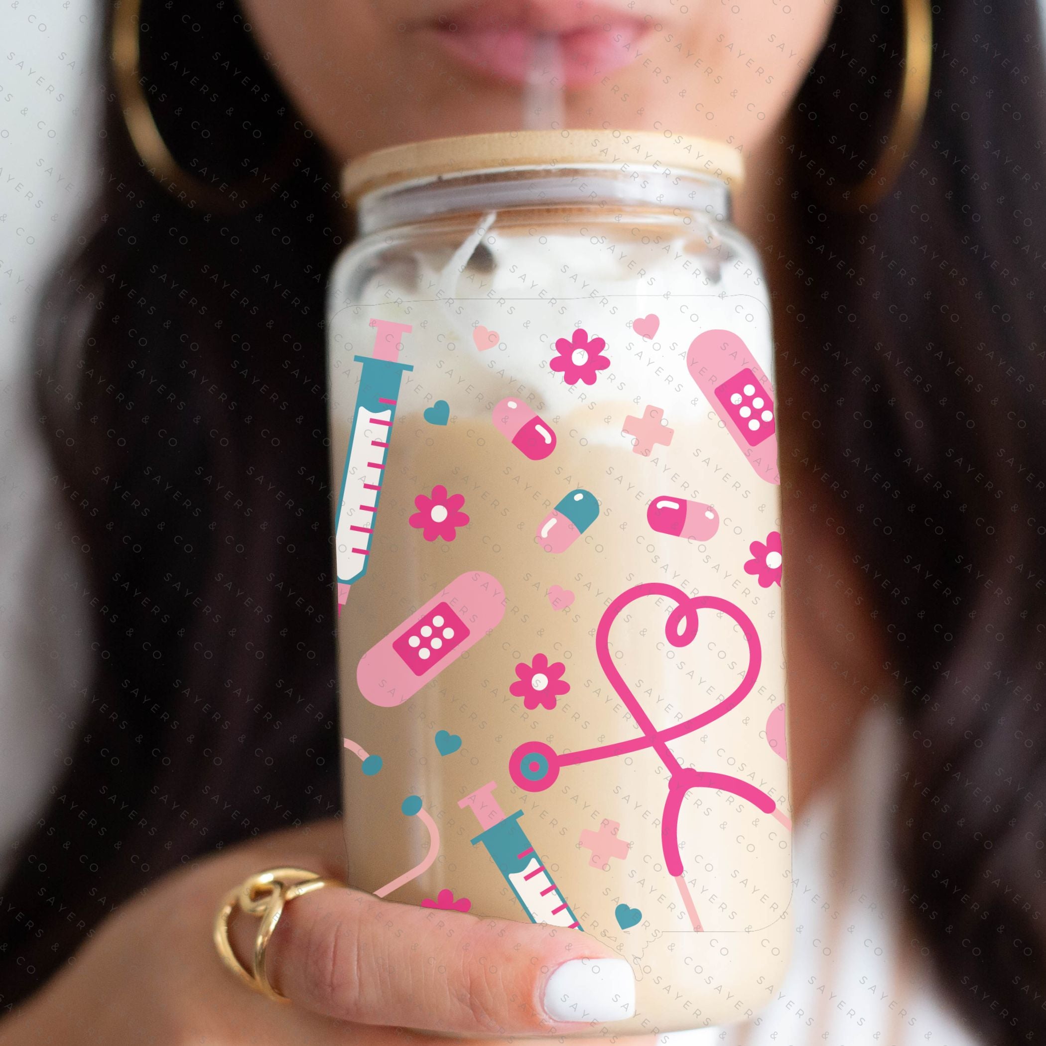 16oz Nifty Nurse Glass Cup with bamboo lid and straw, featuring a fun design perfect for nurses.