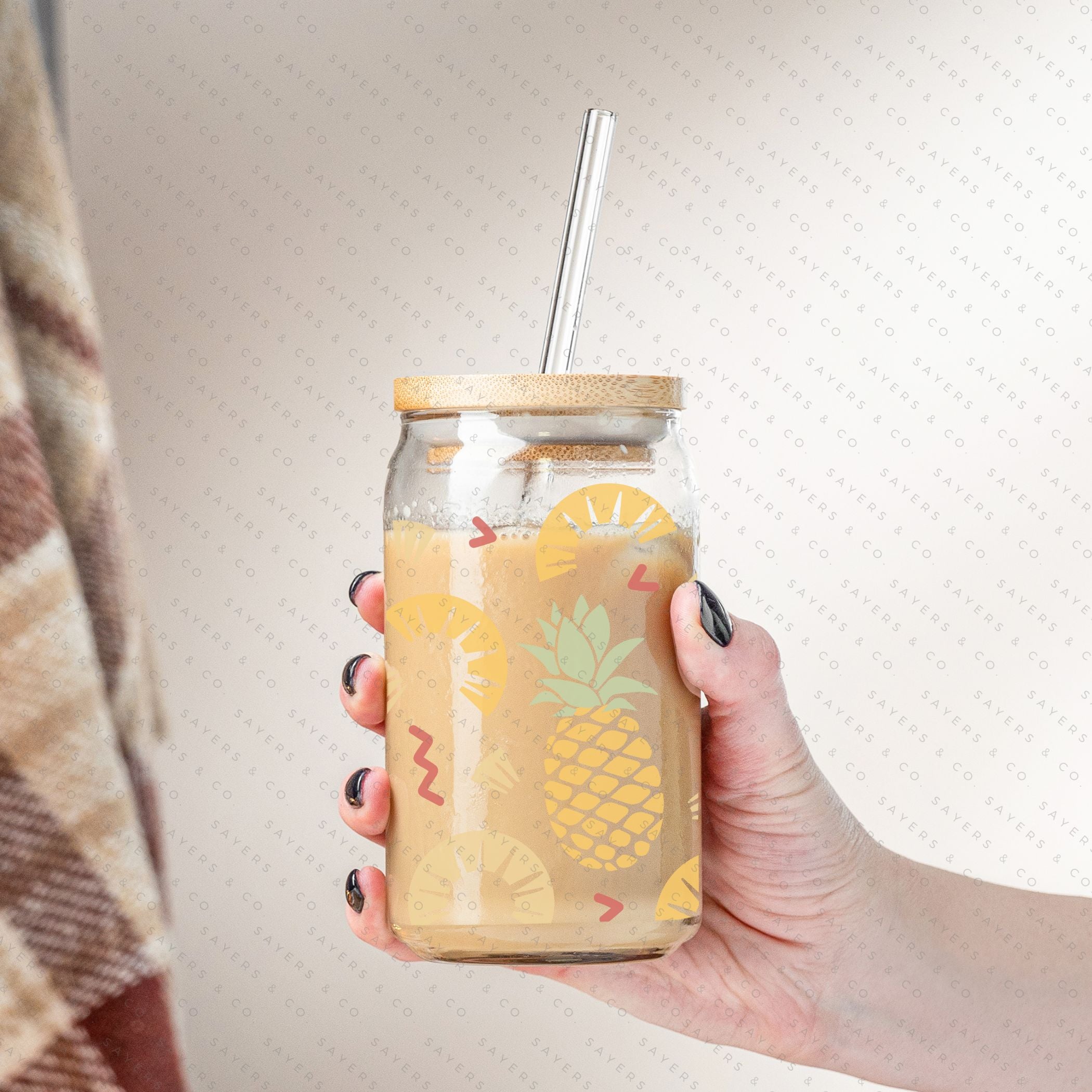 16oz Pineapple Express Glass Cup with bamboo lid and straw, featuring a tropical pineapple design, perfect for drinks.