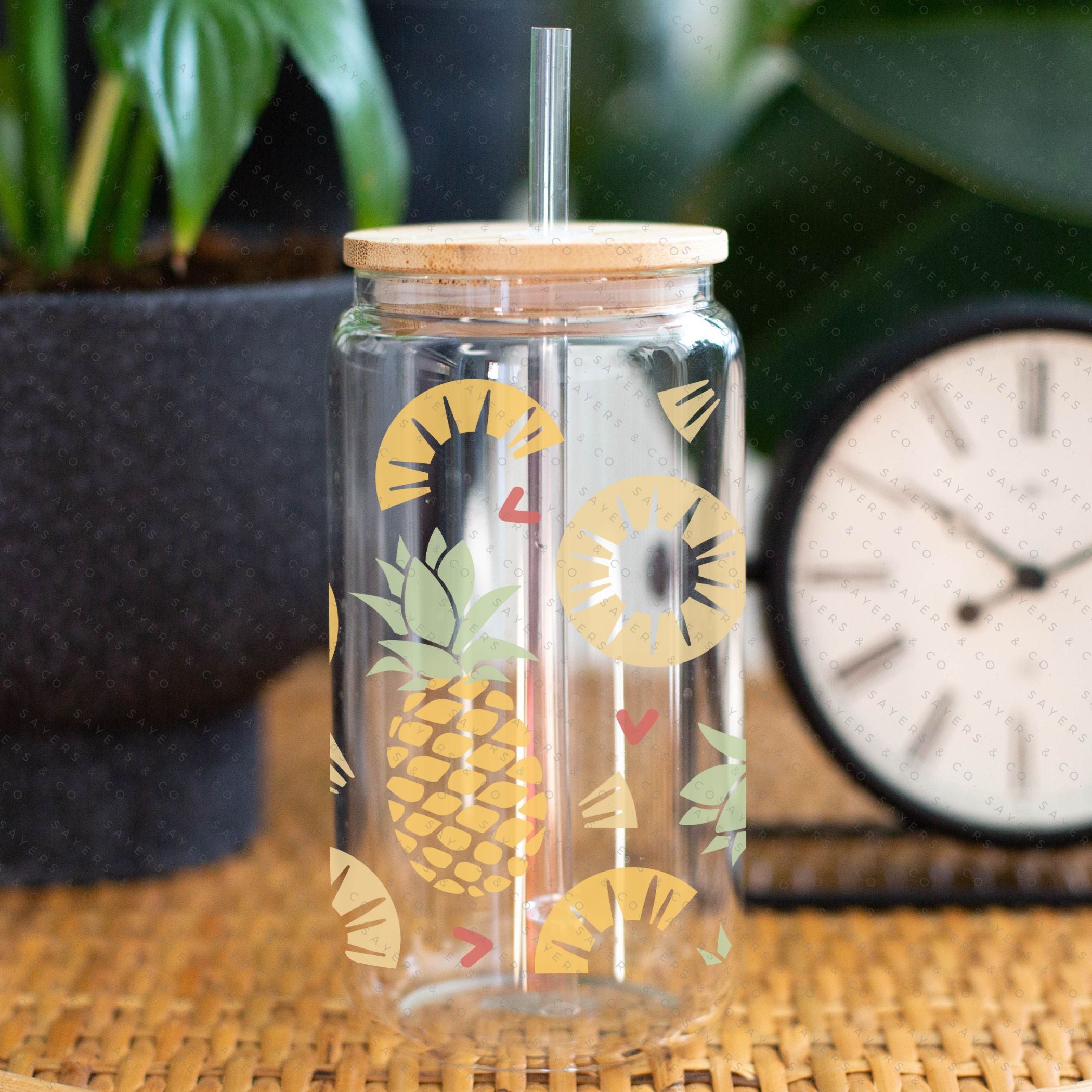16oz Pineapple Express Glass Cup with bamboo lid and straw, featuring a tropical pineapple design, perfect for drinks.