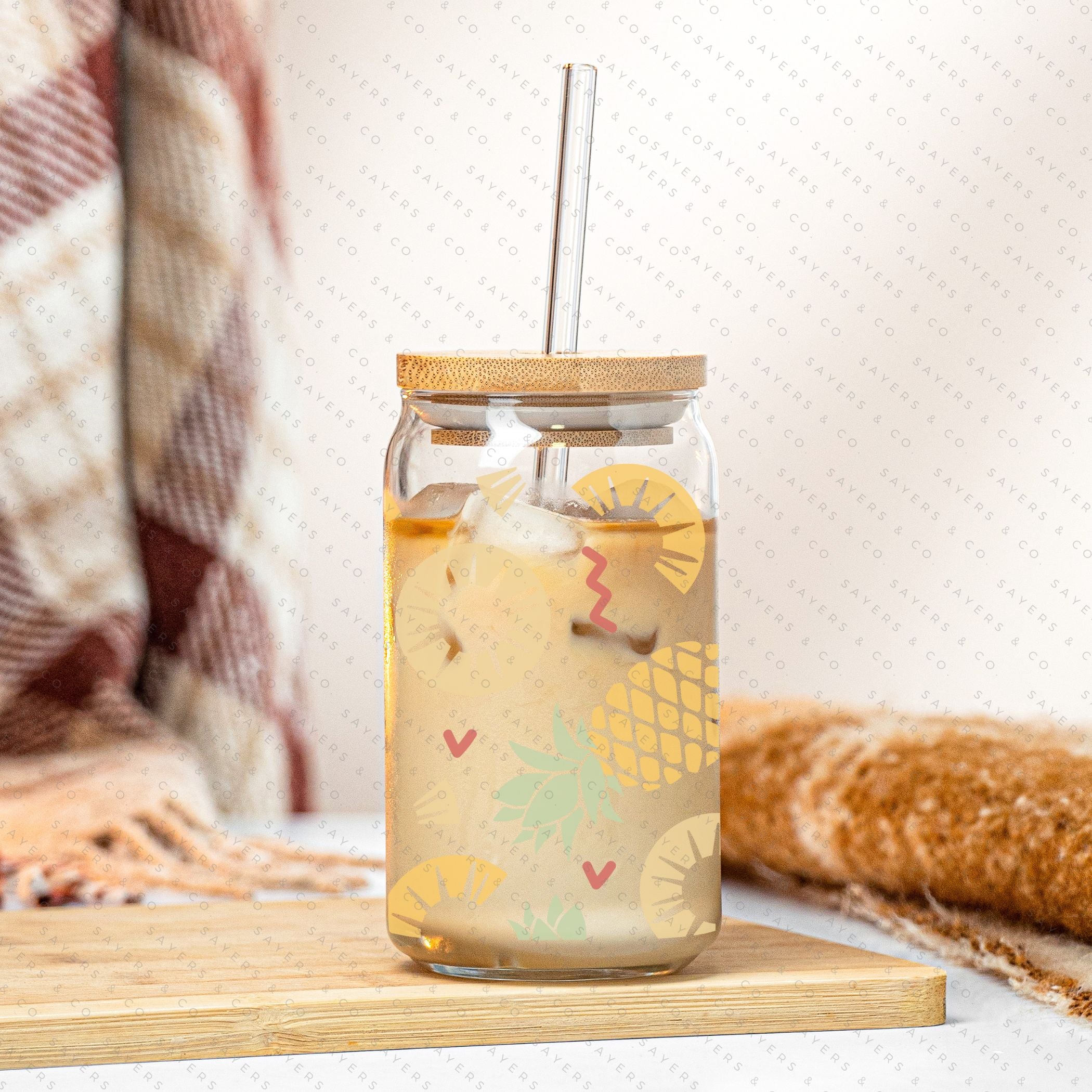 16oz Pineapple Express Glass Cup with bamboo lid and straw, featuring a tropical pineapple design, perfect for drinks.