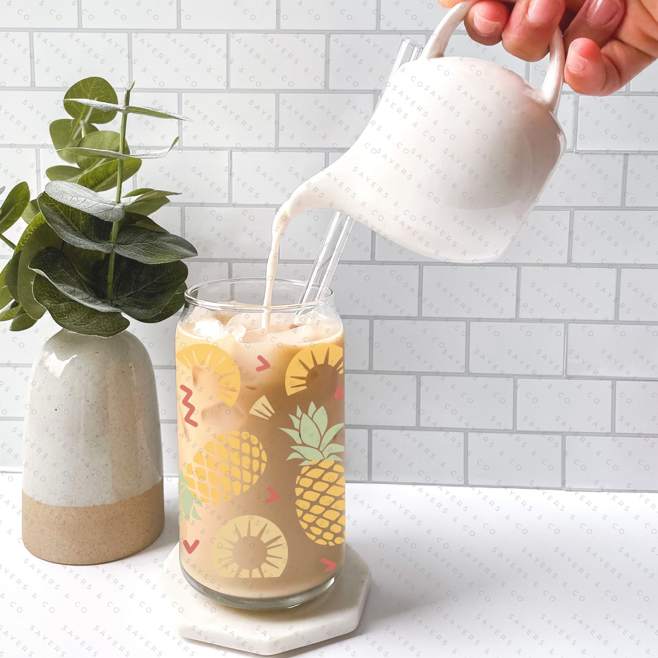 16oz Pineapple Express Glass Cup with bamboo lid and straw, featuring a tropical pineapple design, perfect for drinks.