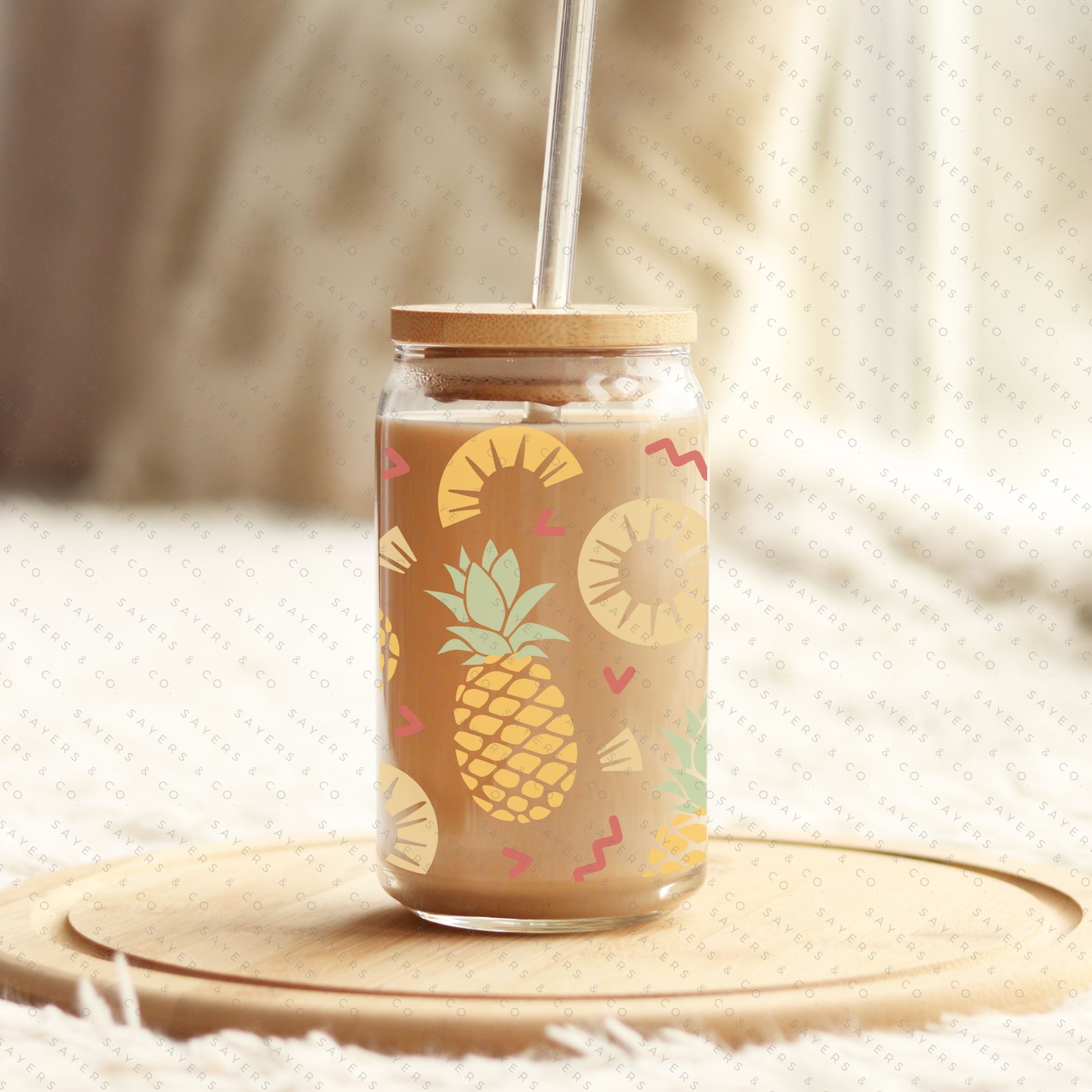 16oz Pineapple Express Glass Cup with bamboo lid and straw, featuring a tropical pineapple design, perfect for drinks.